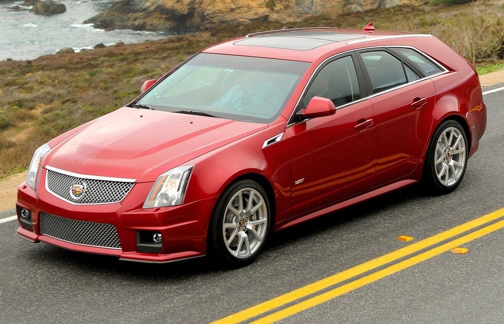A red 2011 Cadillac CTS-V Sport Wagon on the road