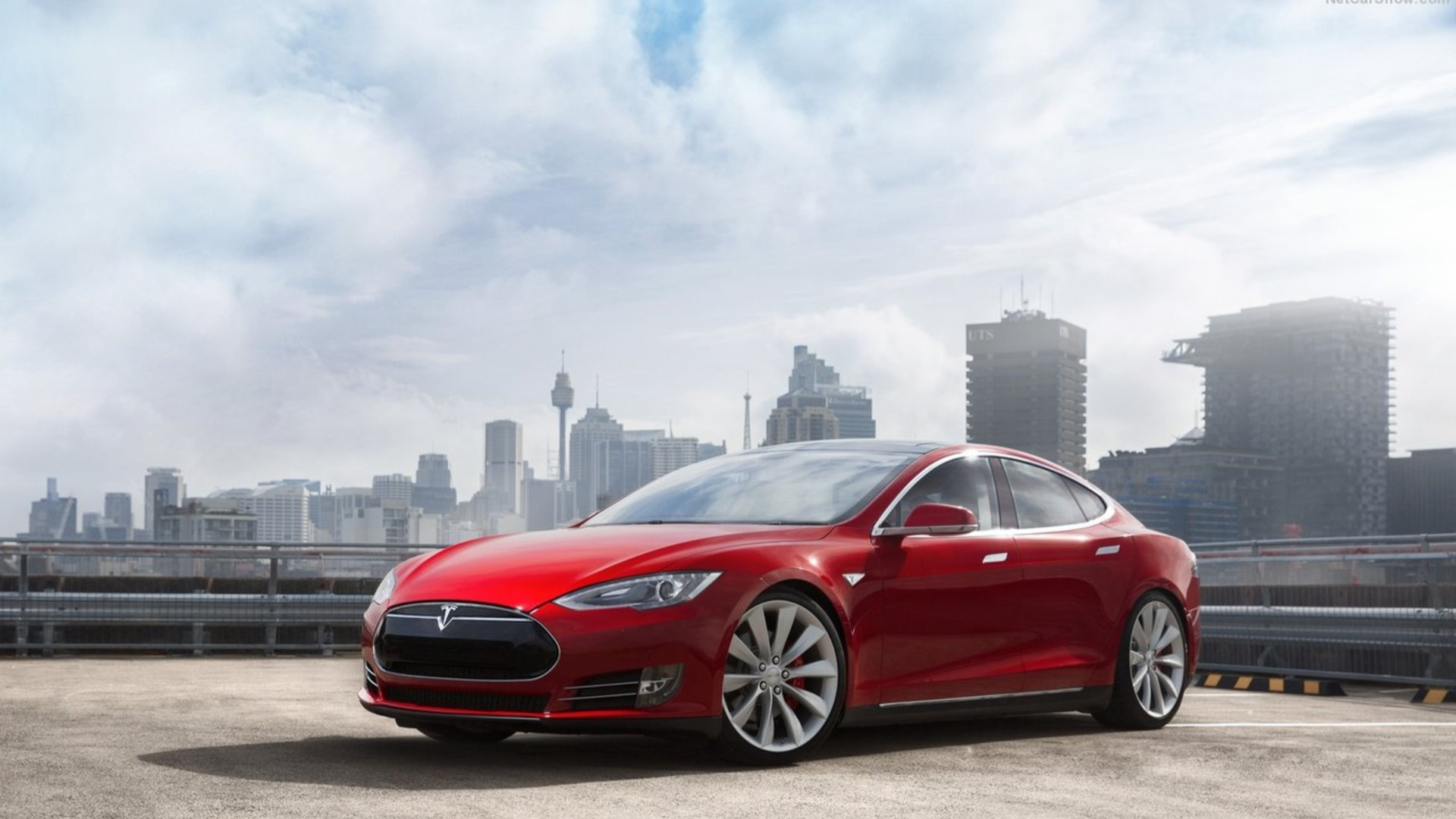 2013 Tesla Model S red EV parked