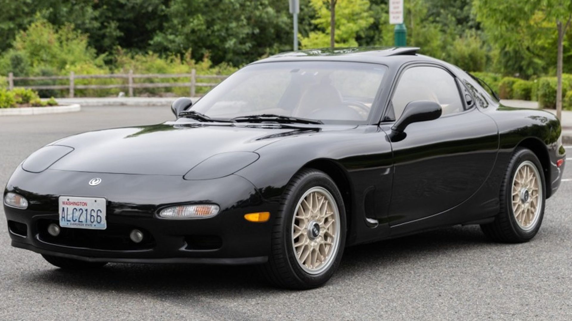 A black 1993 Mazda RX-7 Touring parked 