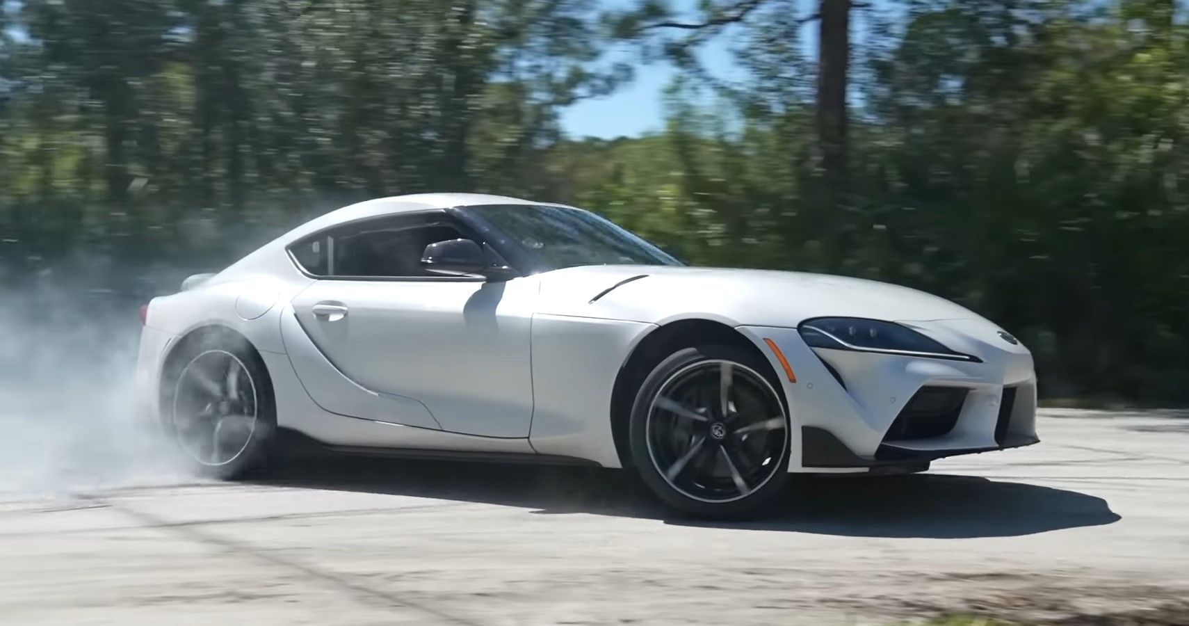 A white Toyota GR Supra A90 MKV drifting