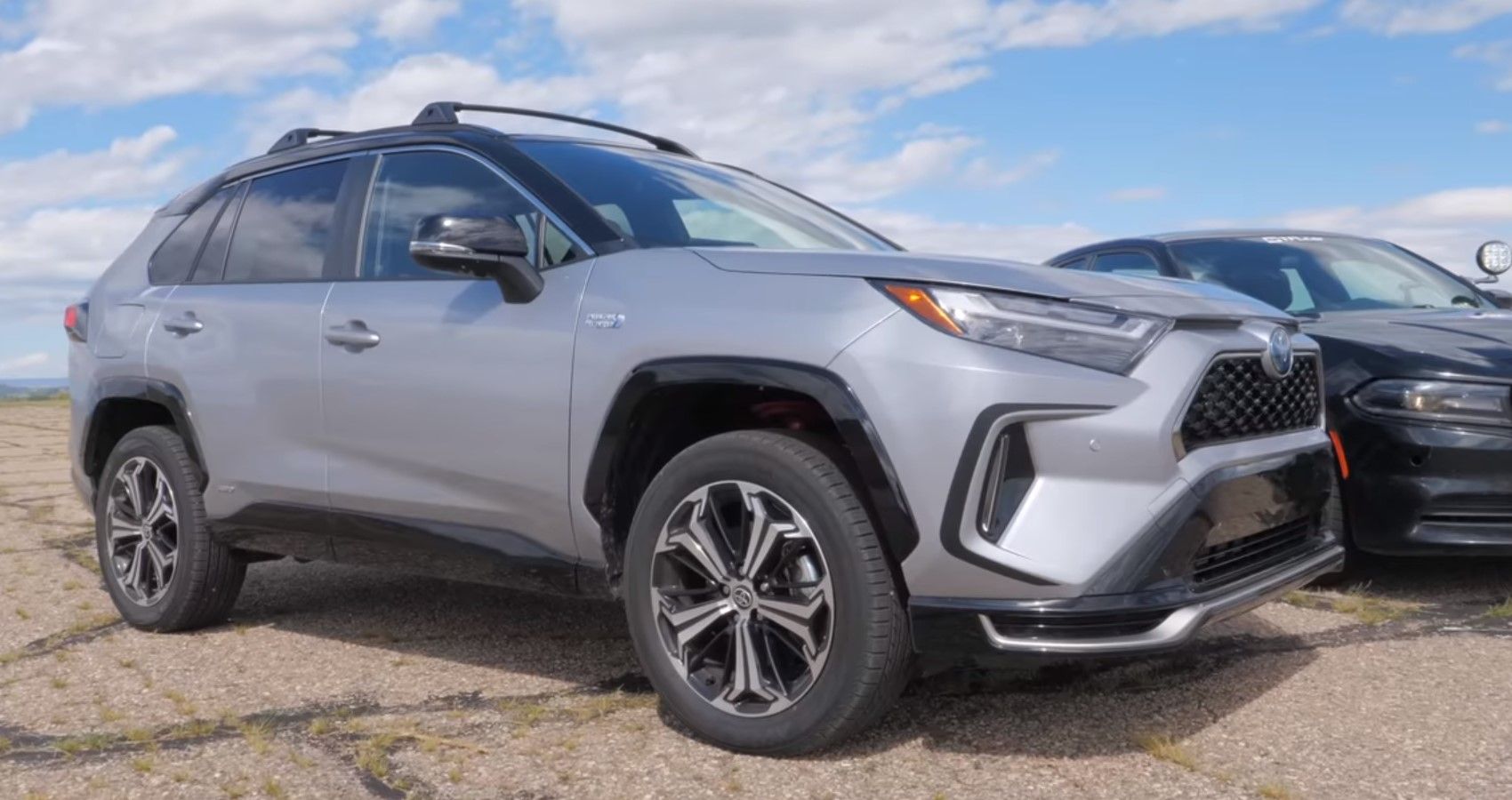 2023 Toyota RAV4 Prime PHEV / 2019 Dodge Charger PPV, front quarter closeup of RAV4