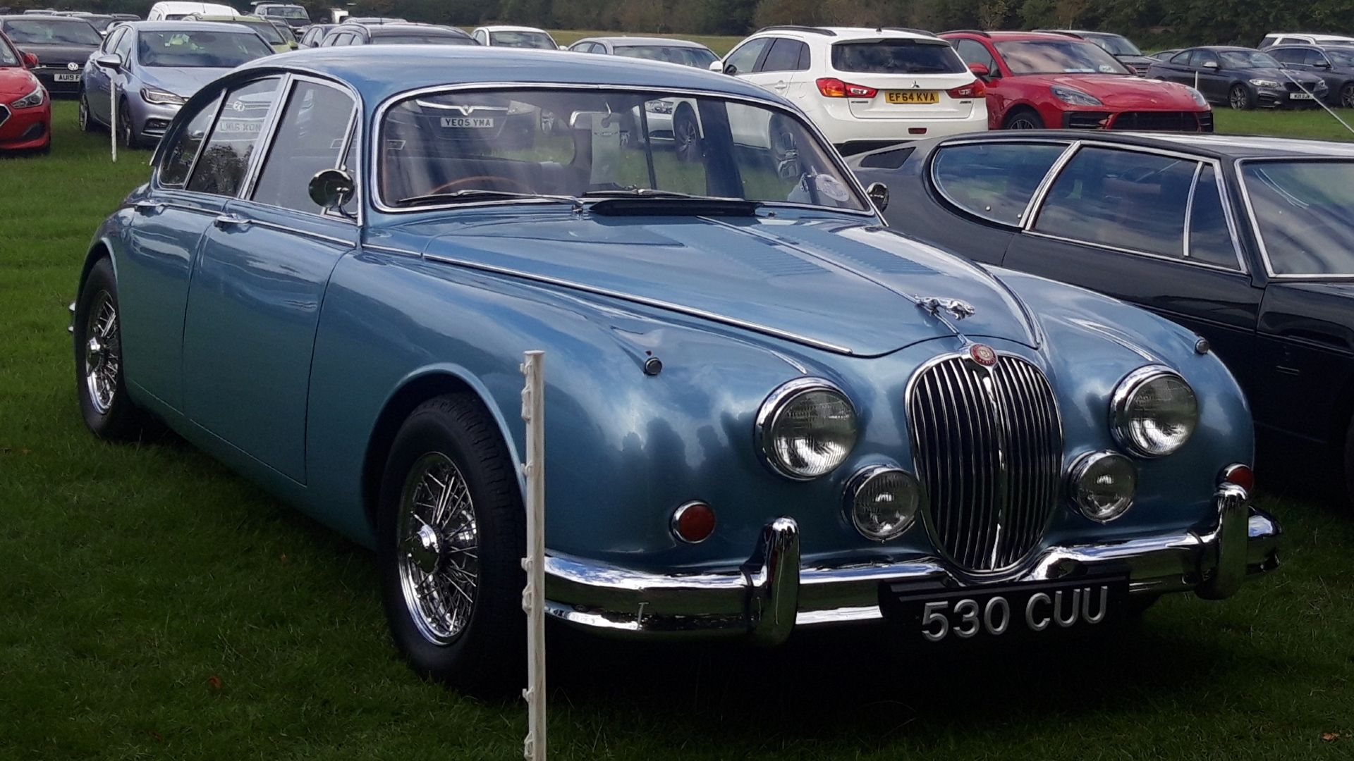 1961 Jaguar Mark II blue classic parked
