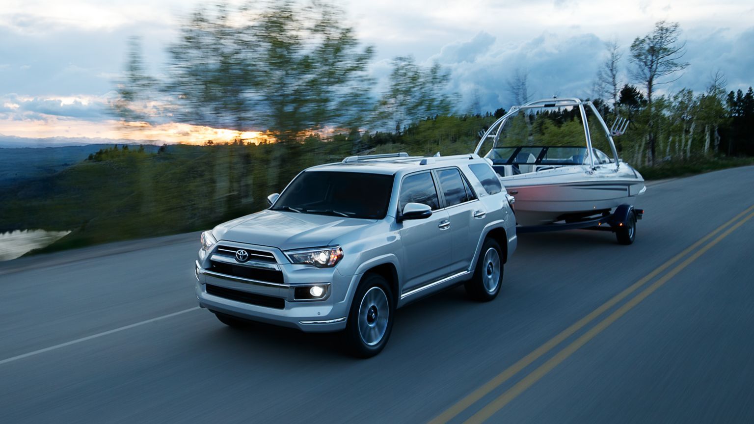 2024 Toyota 4Runner Limited in Classic Silver Metallic towing a boat