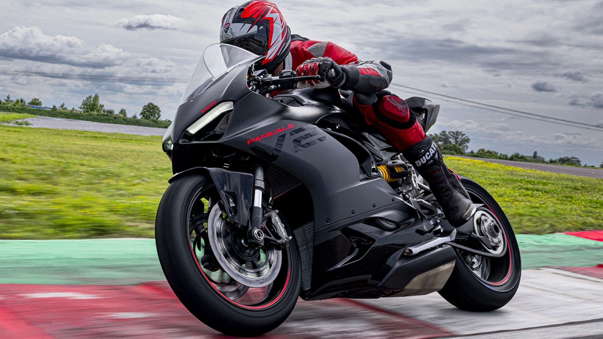 2023 Ducati Panigale V2 in black cornering view on racetrack