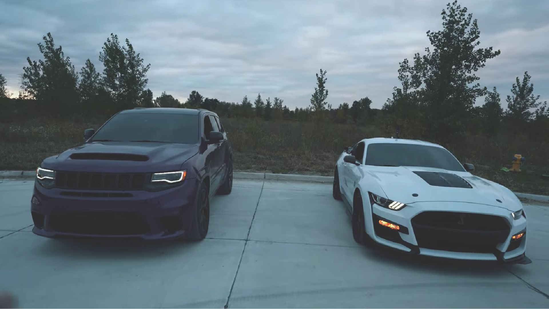 Purple Jeep Trackhawk and White Ford Mustang Shelby GT500