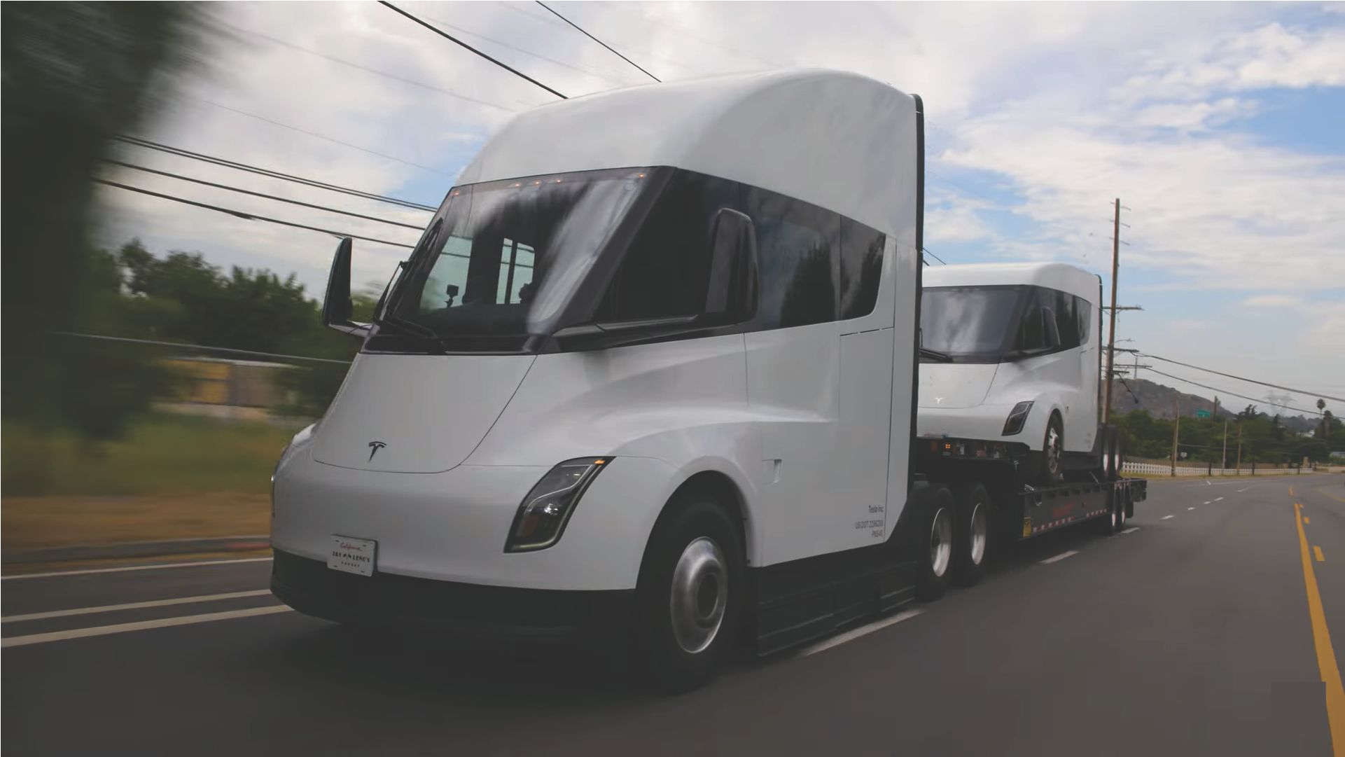 Jay Leno hauling a Tesla Semi Truck with another Tesla Semi Truck