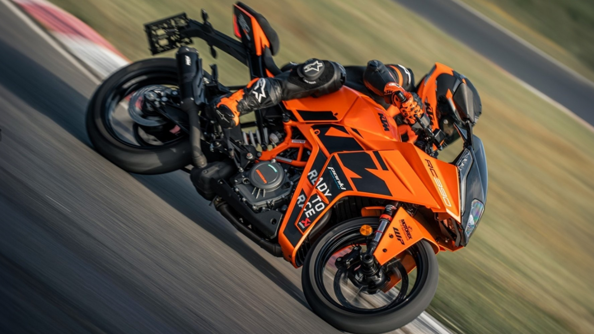 2023 KTM RC 390 cornering on a racetrack cinematic view