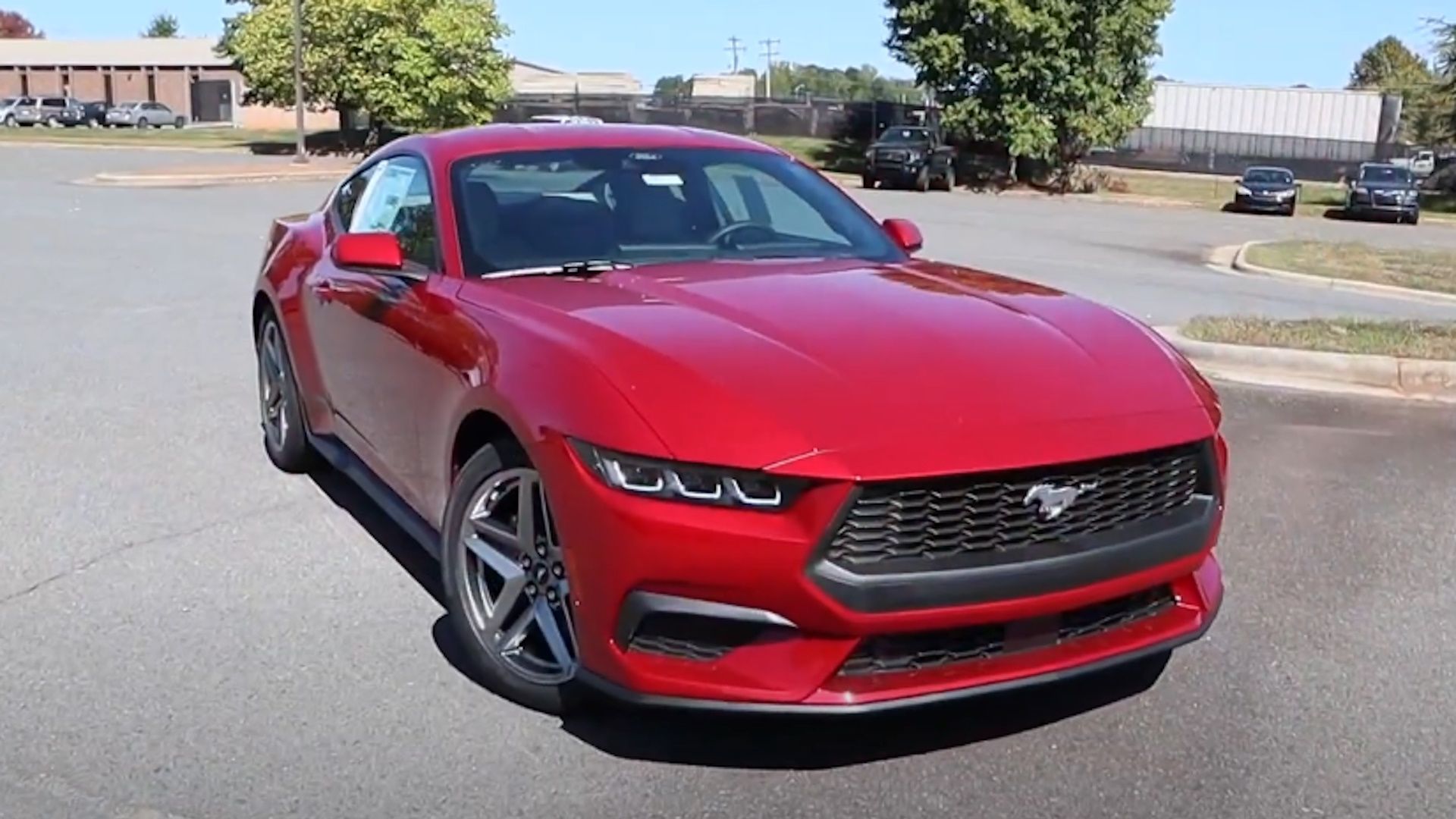 Front view of a red 2024 Ford Mustang EcoBoost Fastback