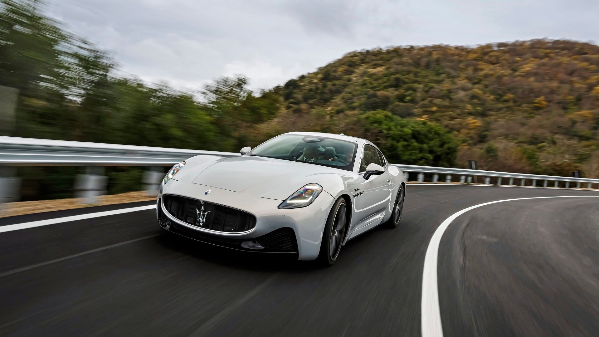 White Maserati GranTurismo on winding road