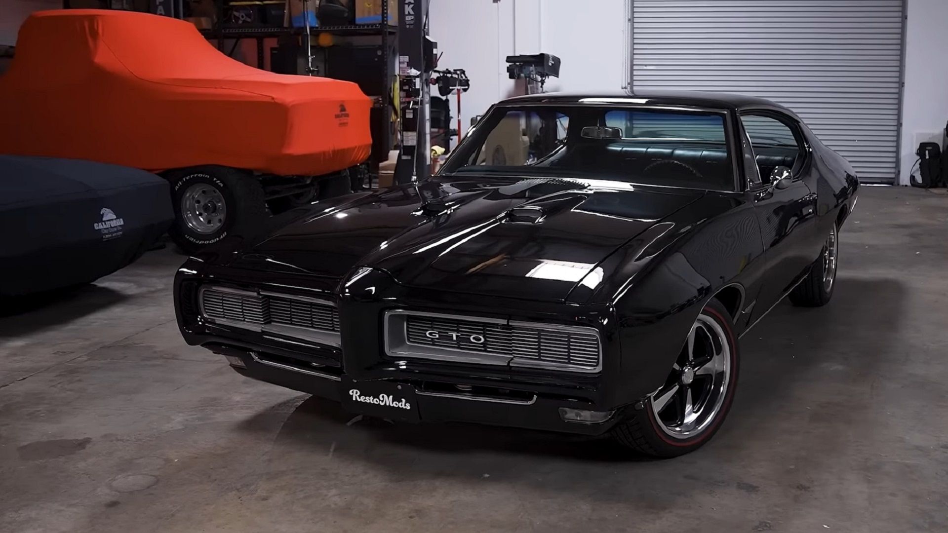 Black 1968 Pontiac GTO in garage from the front 