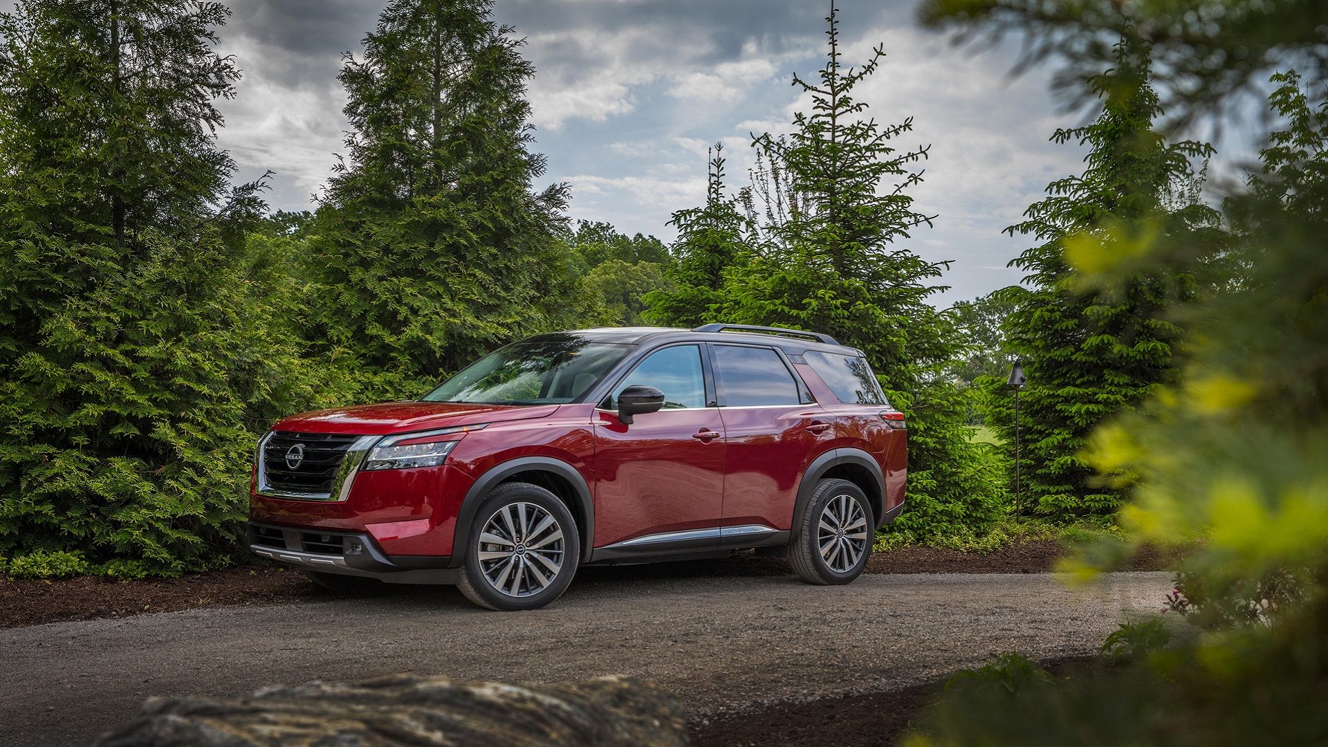 Red 2024 Nissan Pathfinder in outdoor setting