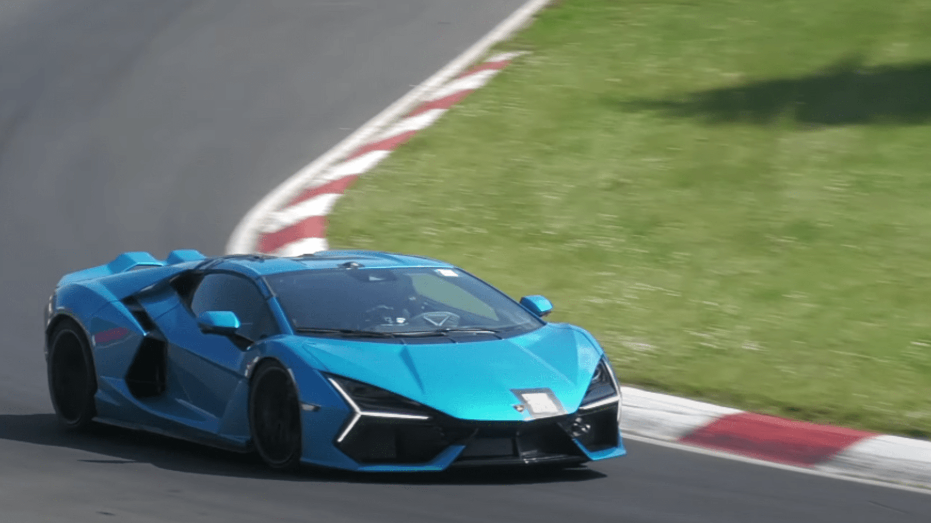 Blue 2024 Lamborghini Revuleto driving 