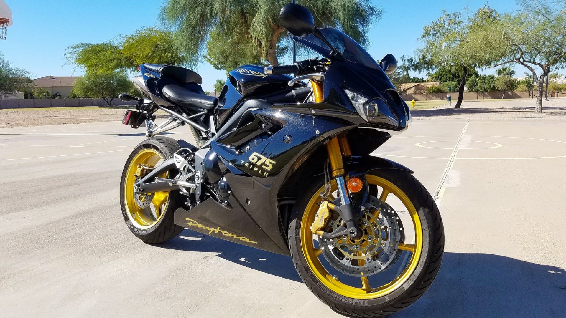 2008 Triumph Daytona 675 Special Edition in black and gold front third quarter view