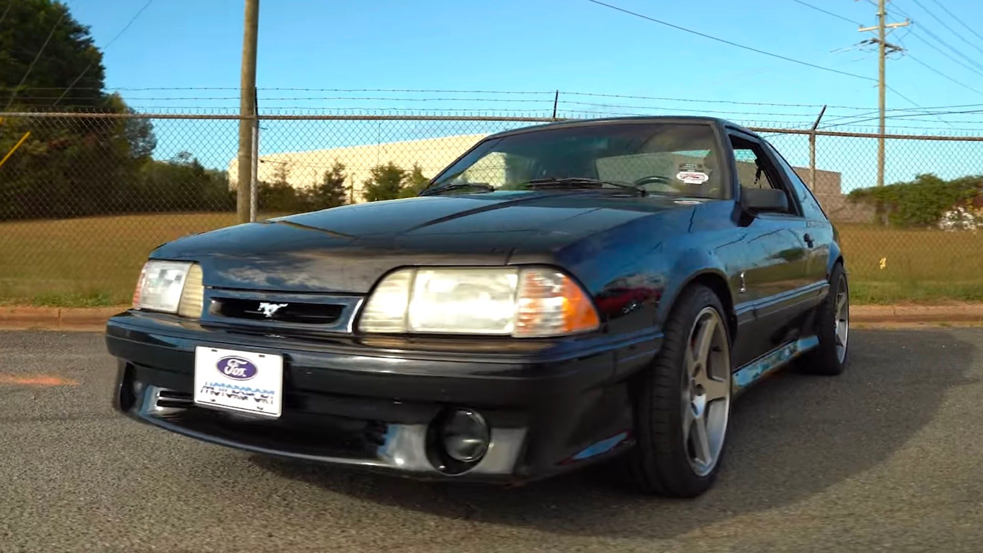 Black supercharged fox body Ford Mustang