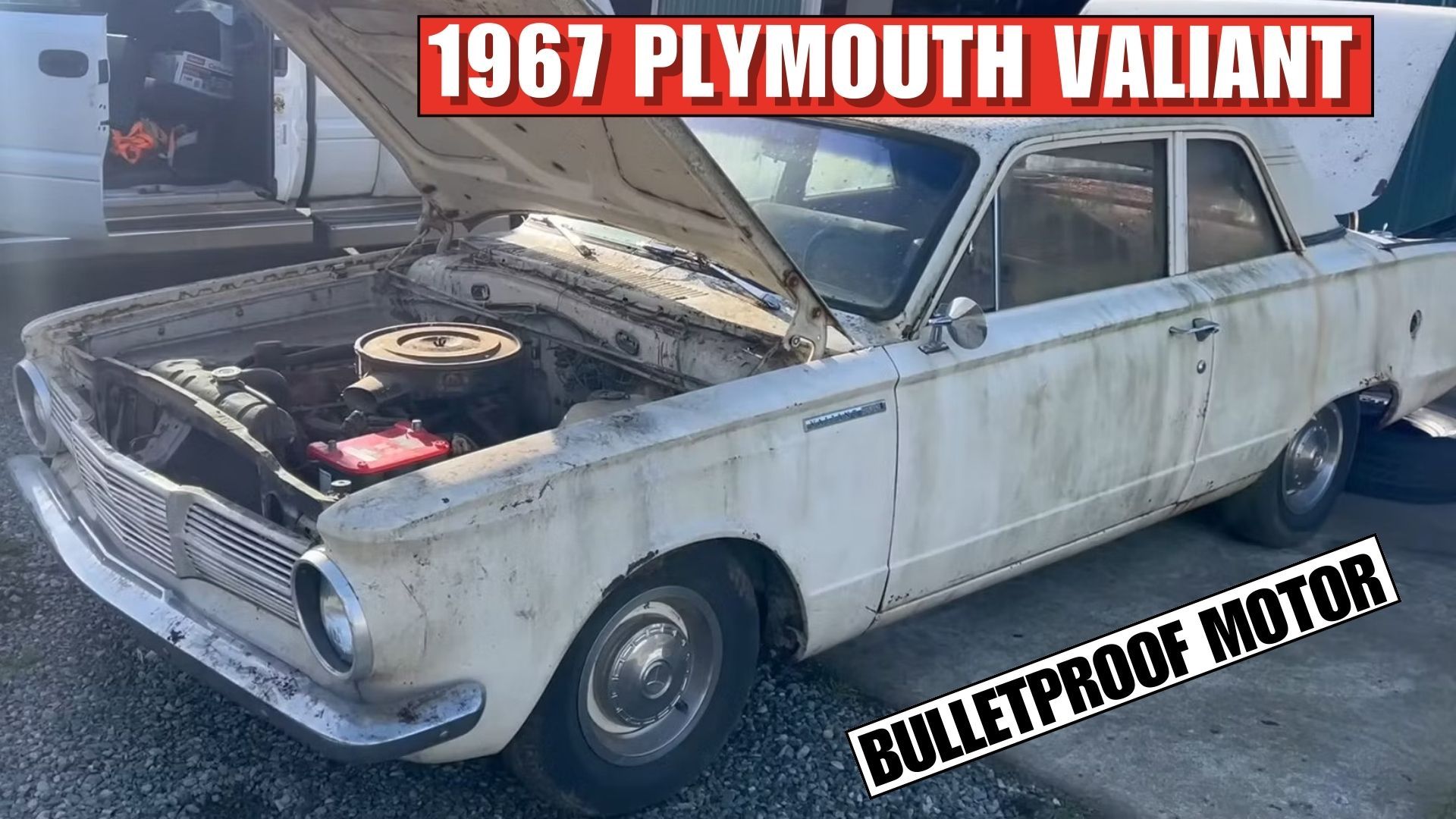 A white 1965 Plymouth Valiant 100 front quarter shot