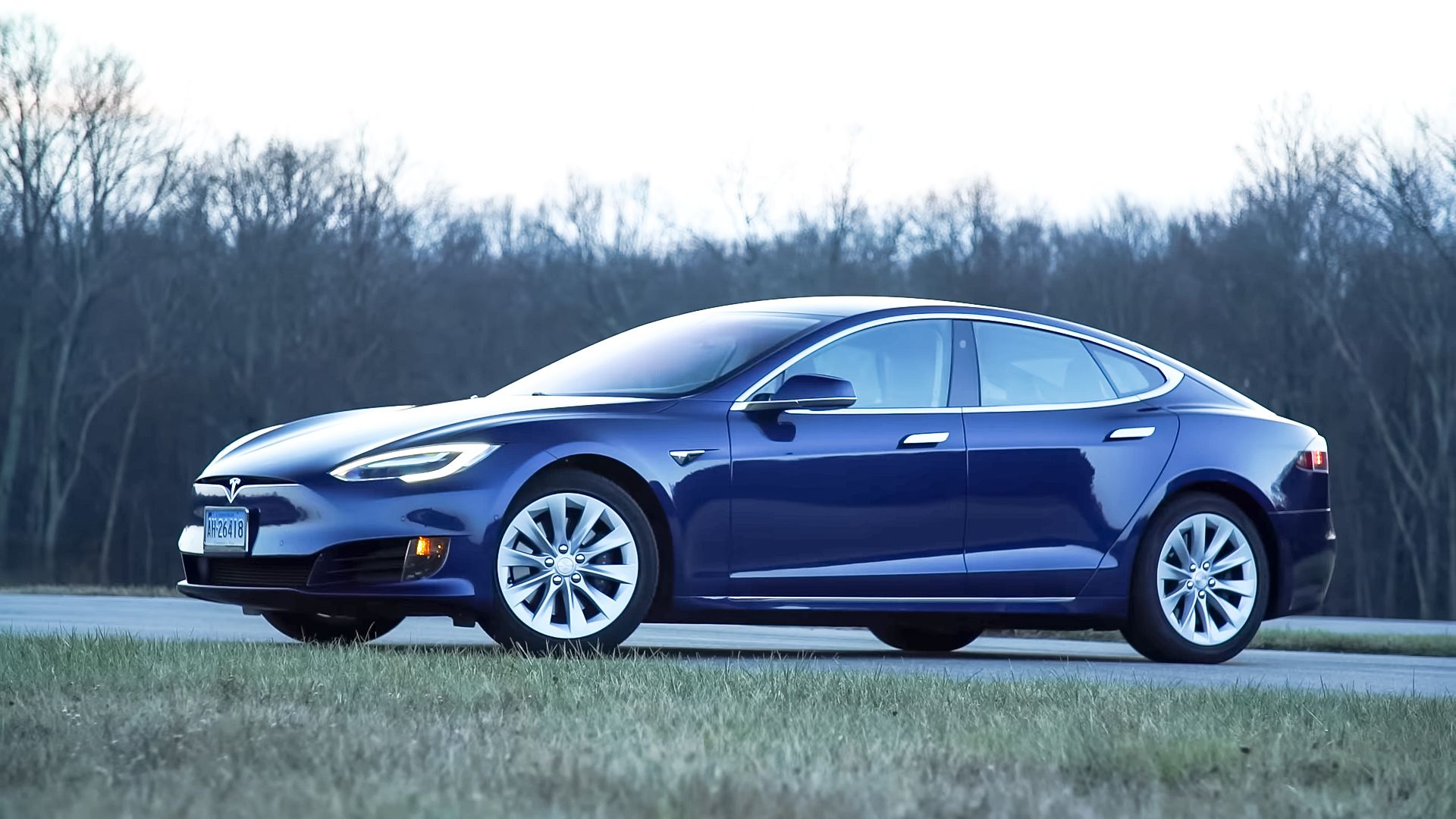 blue 2016 Tesla Model S parked aside the road