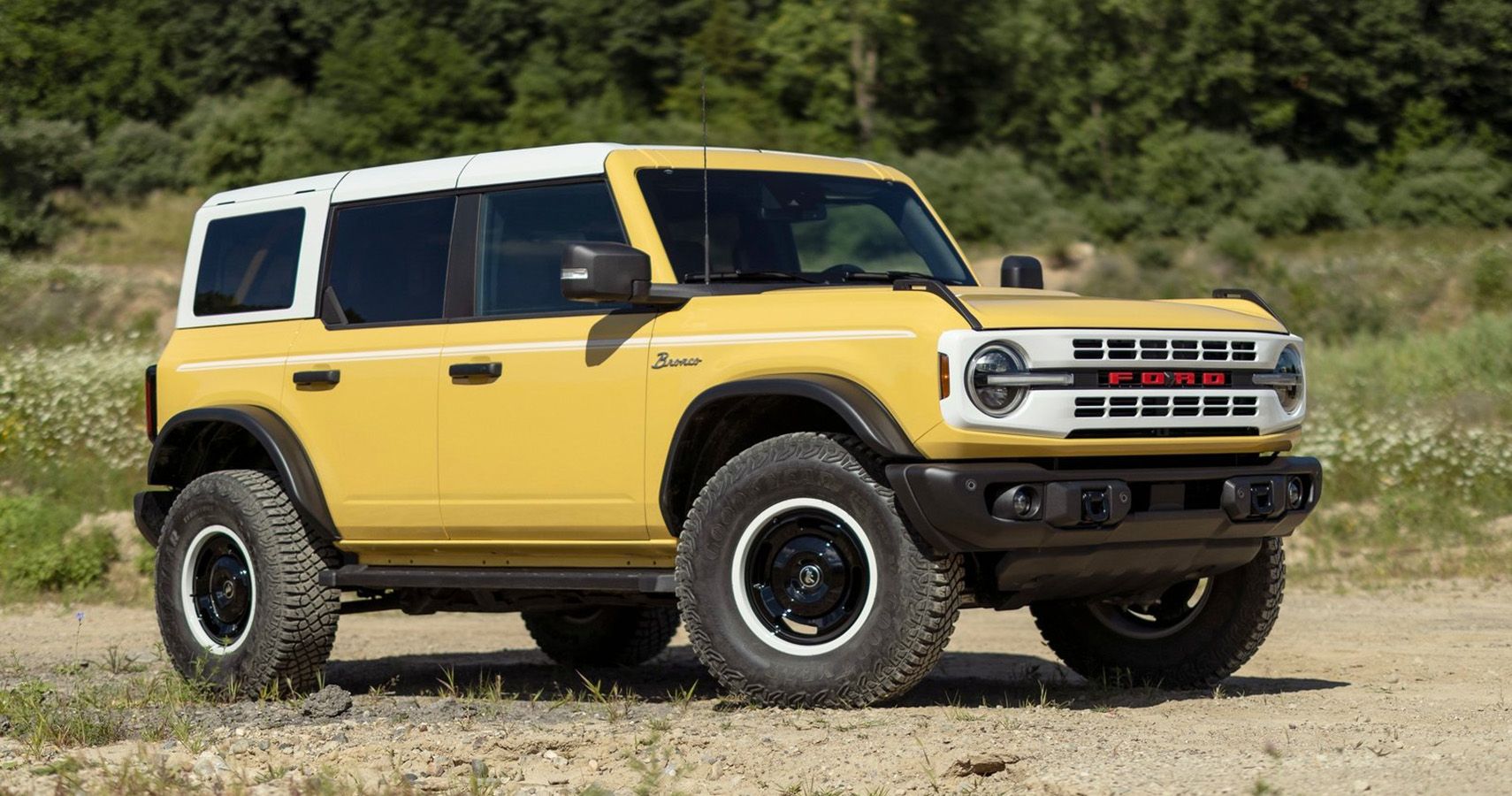 Yellow 2023 Ford Bronco Heritage Edition outside on trail