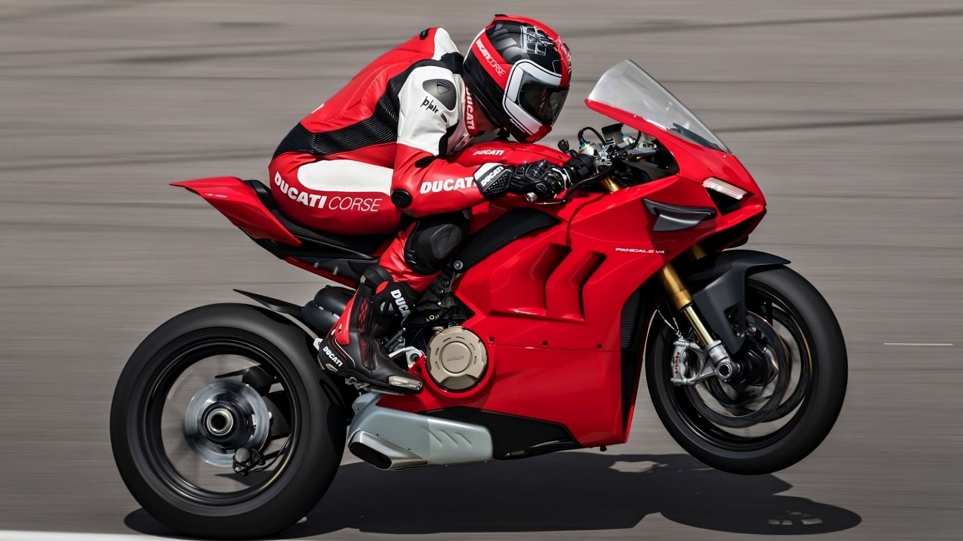 Ducati Panigale V4 S popping a wheelie side profile view