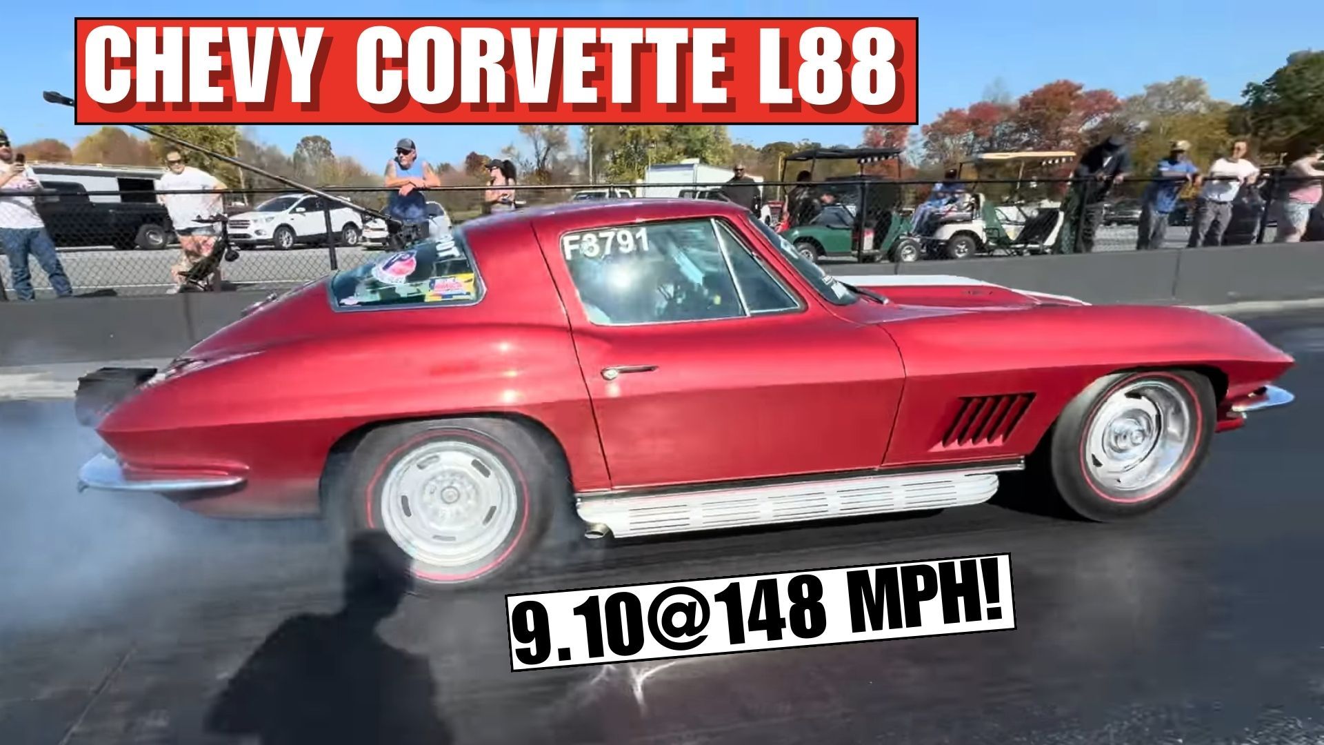 red 1967 Chevrolet Corvette 427 side view about to drag race