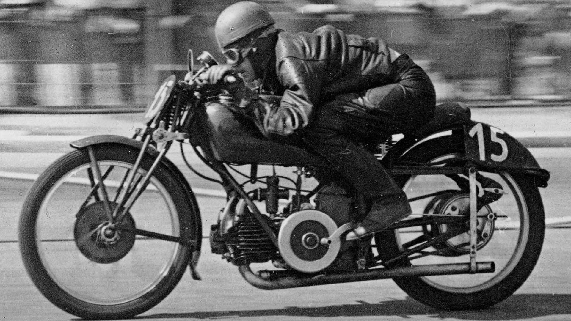 Vintage Moto Guzzi motorcycle racing side profile view