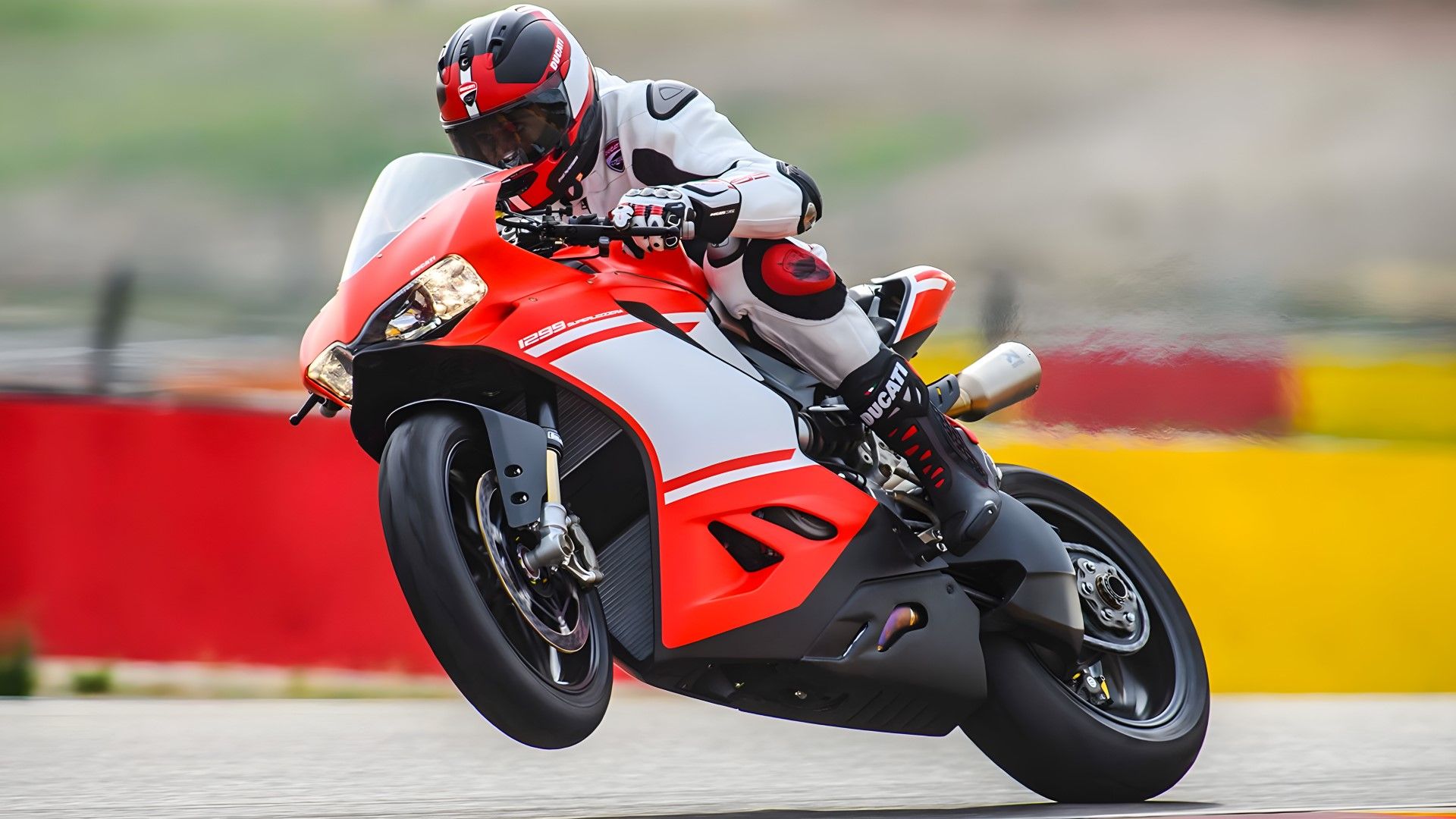 2017 Ducati 1299 Superleggera on a racetrack popping wheelie