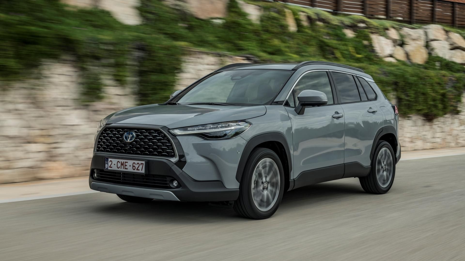 Dynamic shot of a Cement Gray 2022 Toyota Corolla Cross Hybrid