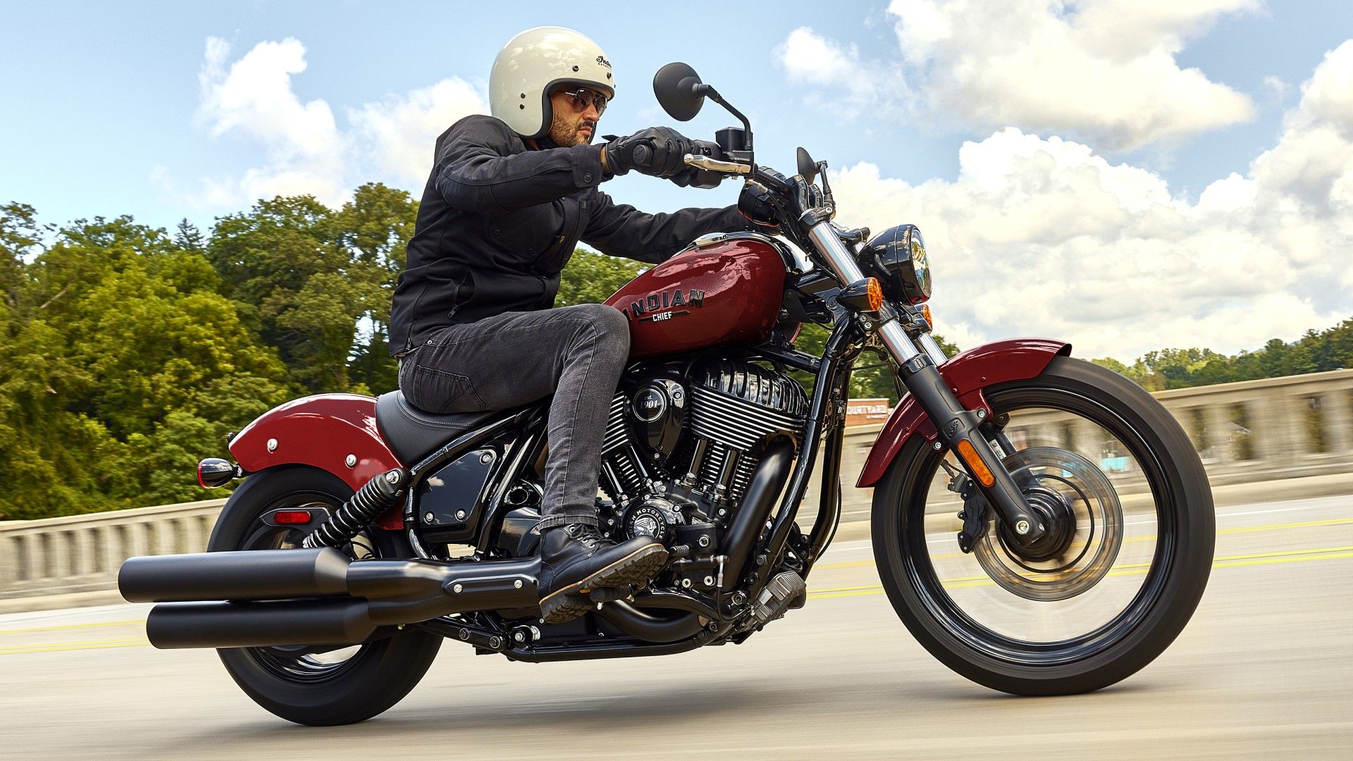 2024 Indian Chief Dark Horse in red accelerating side profile view