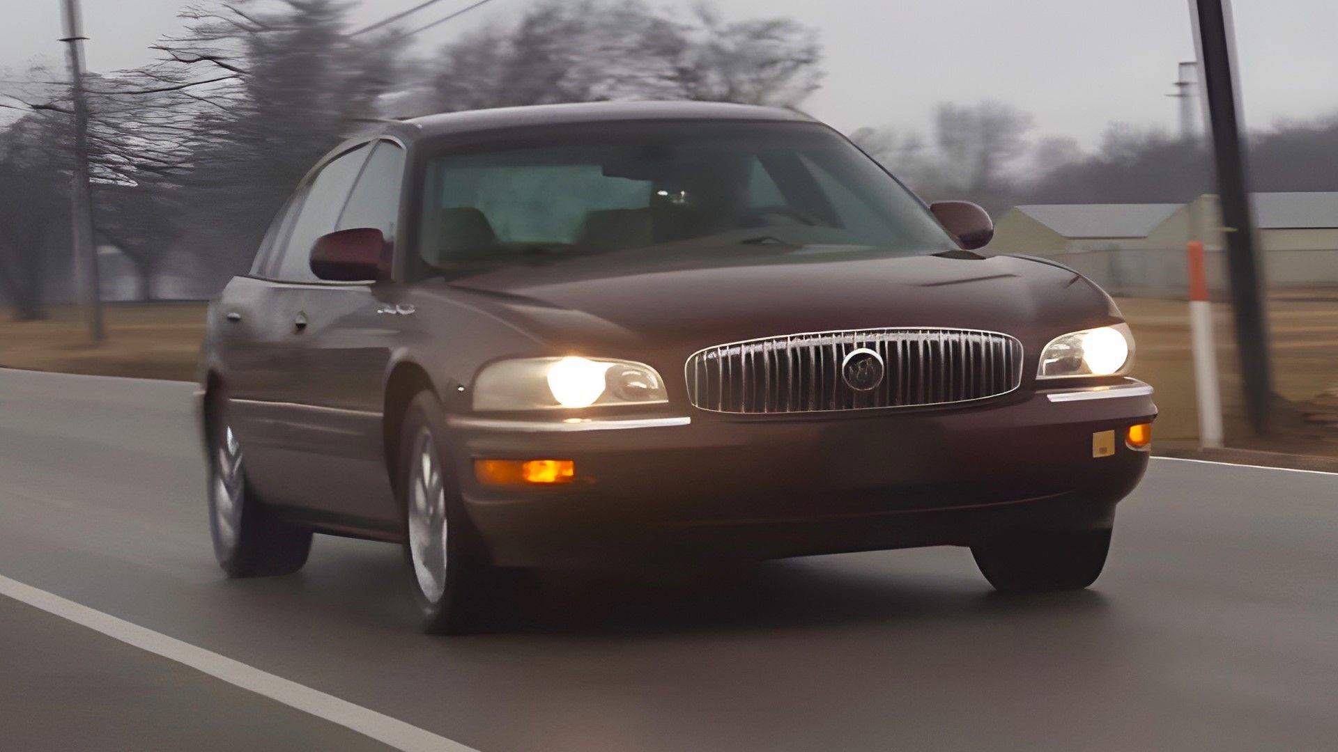 A burgundy 2005 Buick Park Avenue Ultra front quarter rolling shot