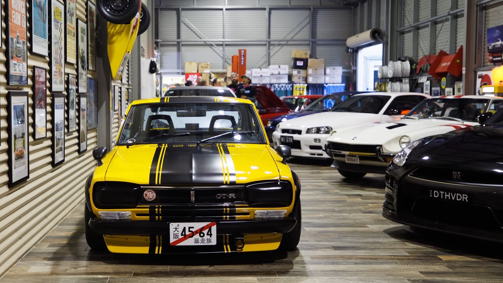 A yellow and black 1971 Nissan Skyline 2000 GT-R car collection front shot