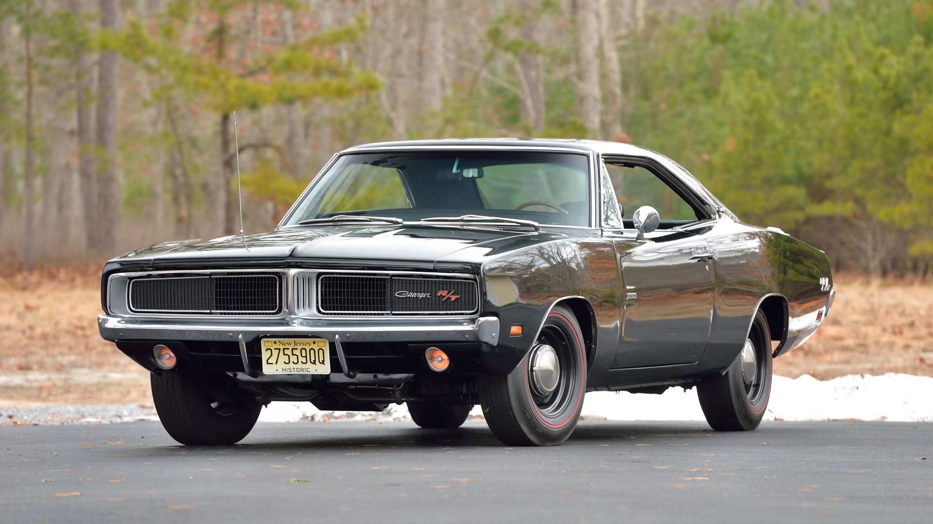 black 1969 Dodge Hemi Charger RT Muscle Car parked outside