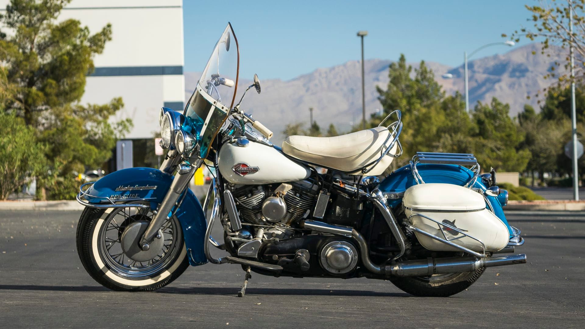1959 Harley-Davidson FLH Duo-Glide in a striking shade of blue and white side profile view