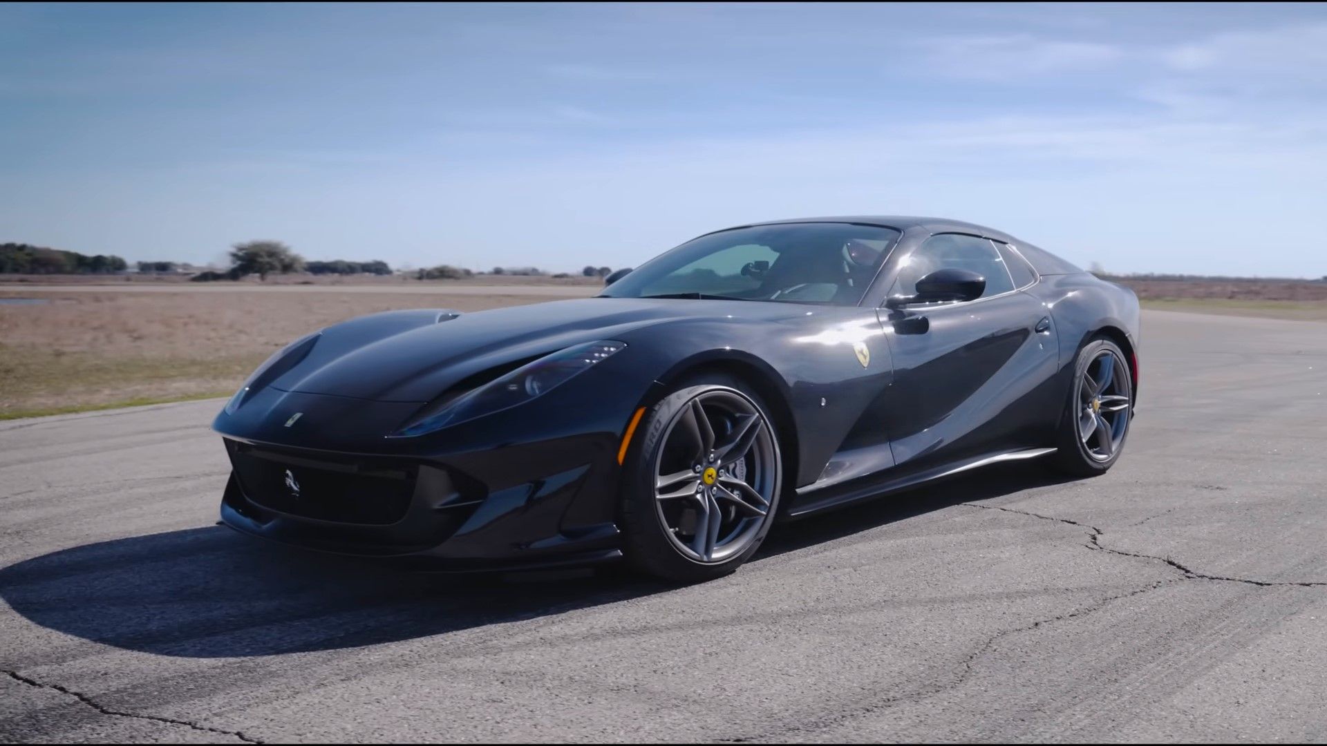 A black 2023 Ferrari 812 GTS front quarter shot