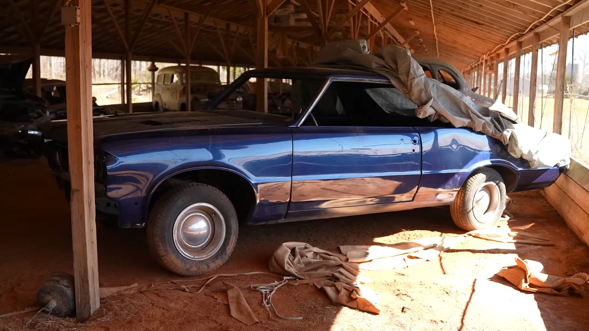 A blue 1964 Pontiac GTO barn find front side shot