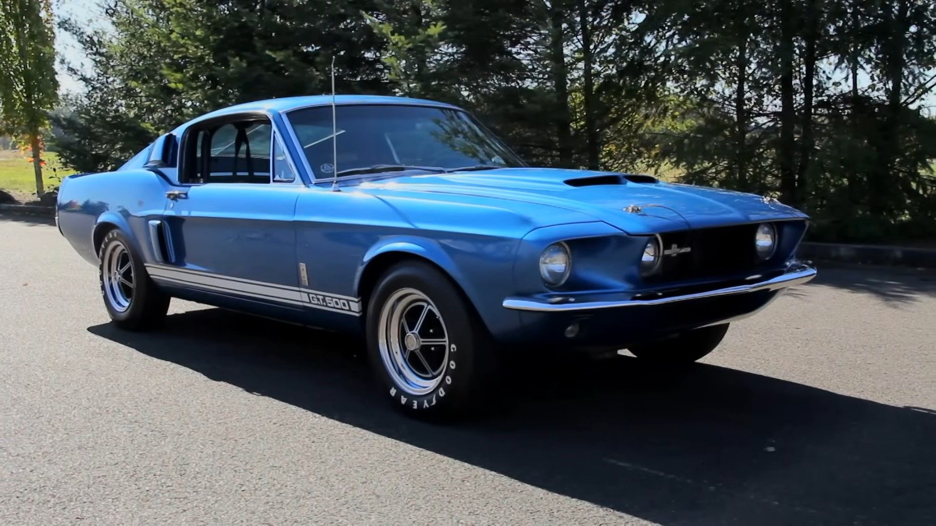 long shot of 1967 Ford mustang Shelby GT500 in pink