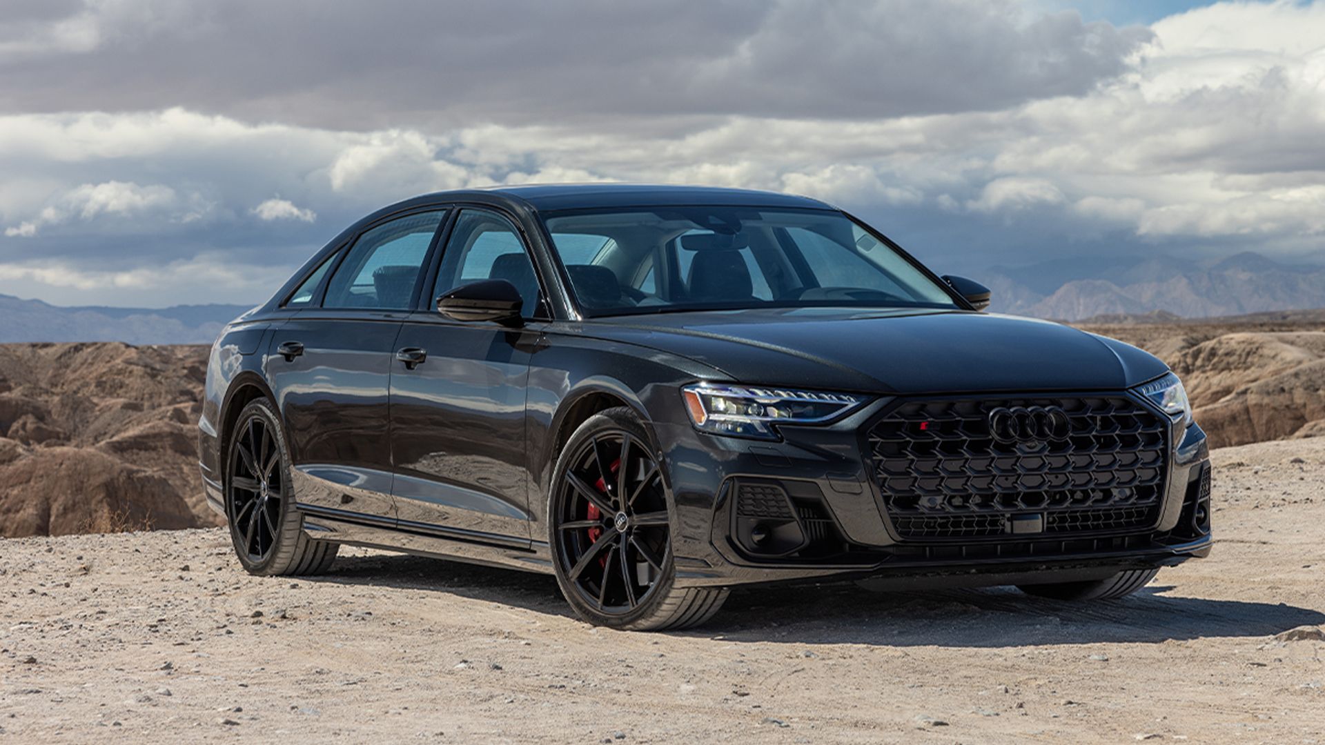 black 2024 Audi S8 parked offroad on gravel road