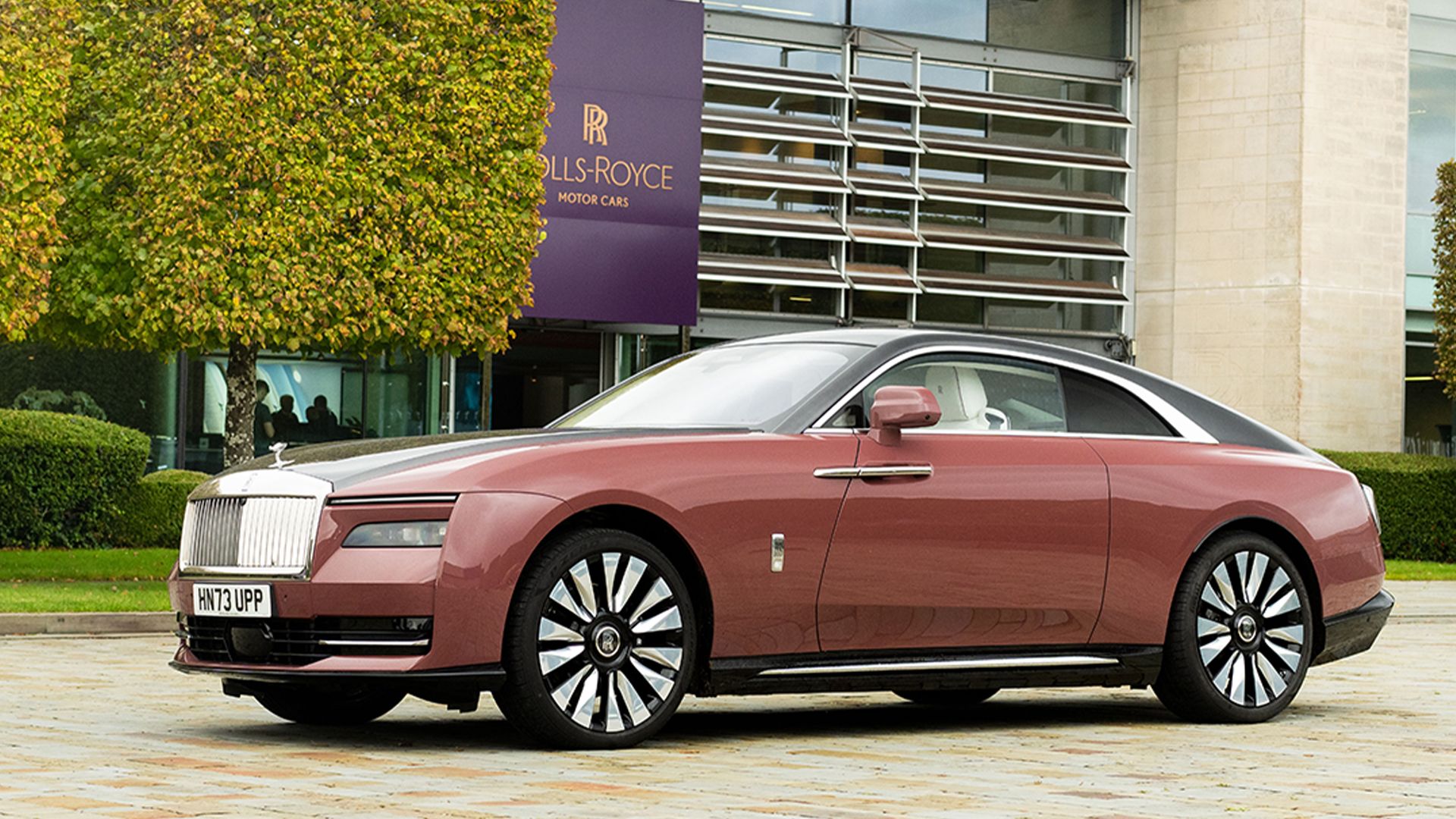 pearl 2024 Rolls-Royce Spectre parked on the driveway