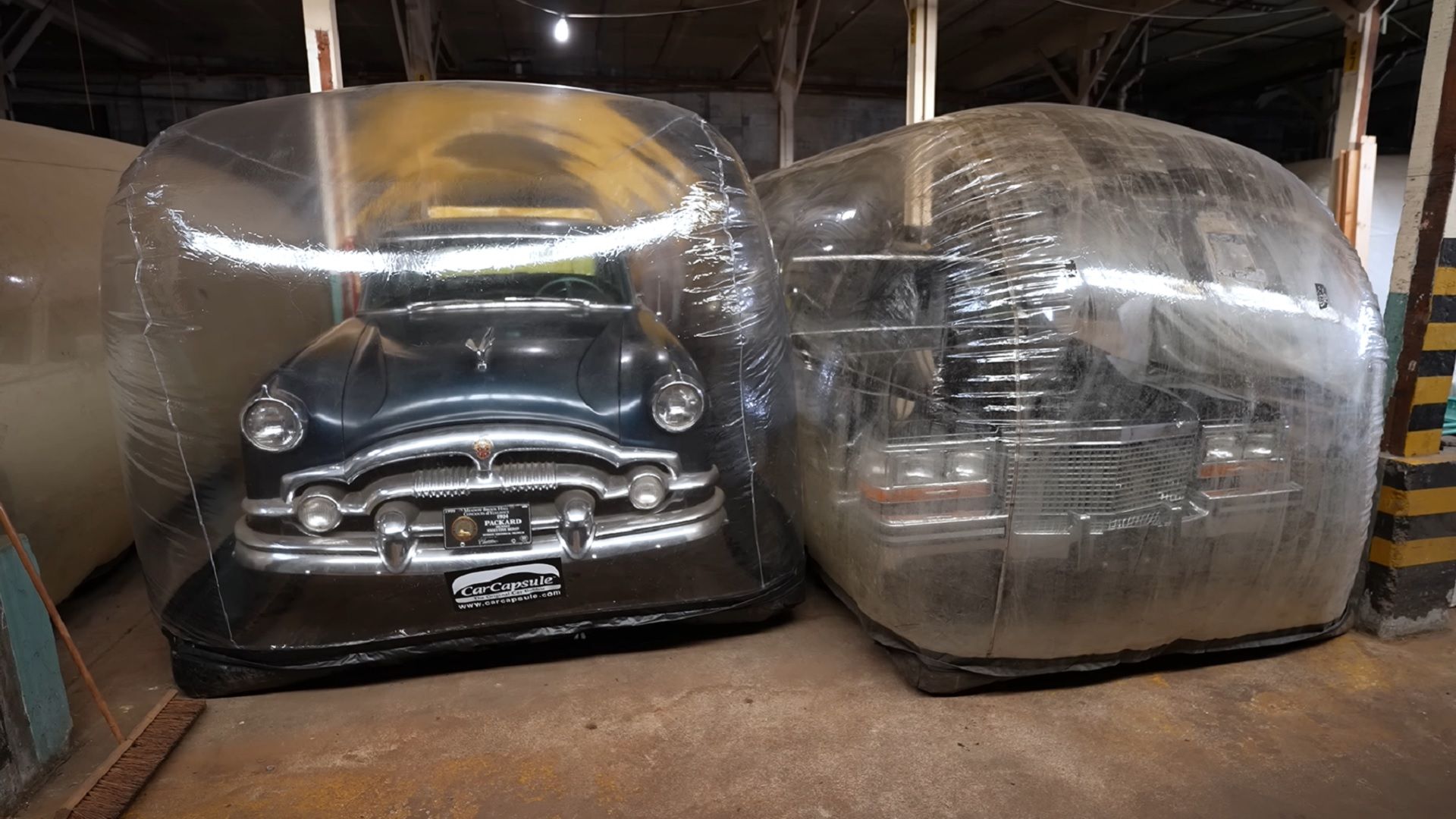 DHS warehouse with cars in plastic pods