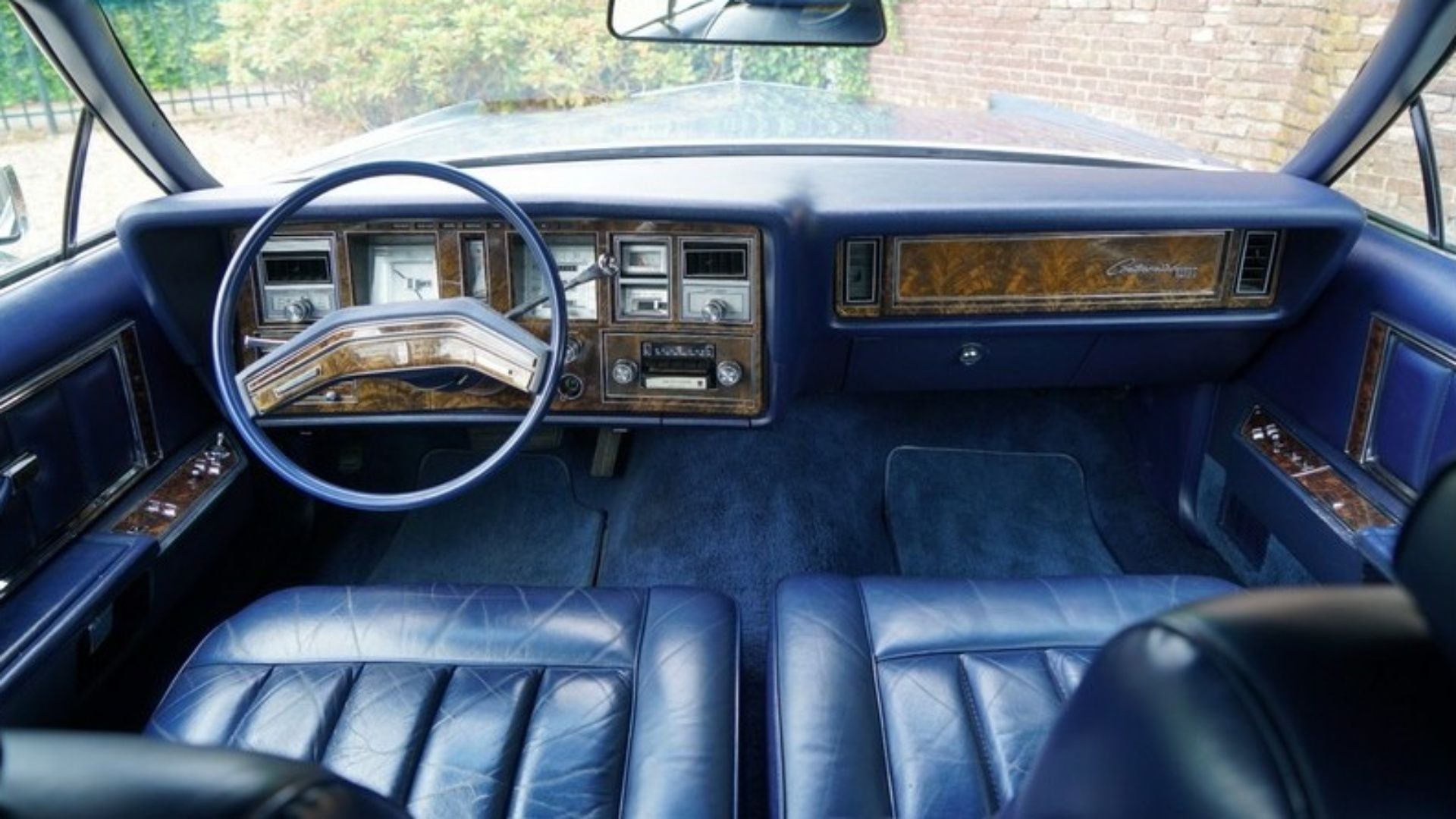 Image of the black leather interior of a Lincoln Continental Mark V