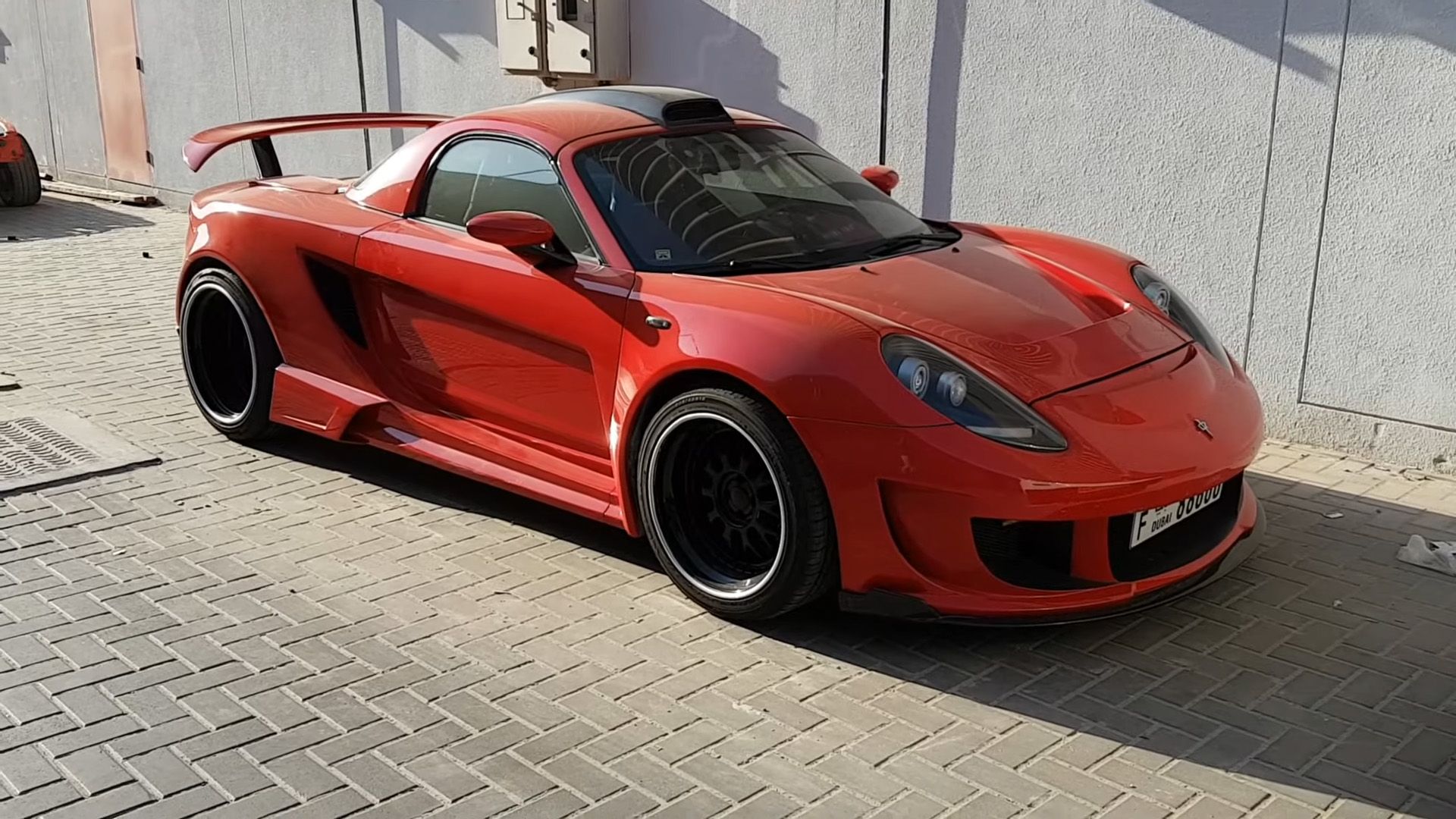 red Toyota MR2 With A Widebody kit parked