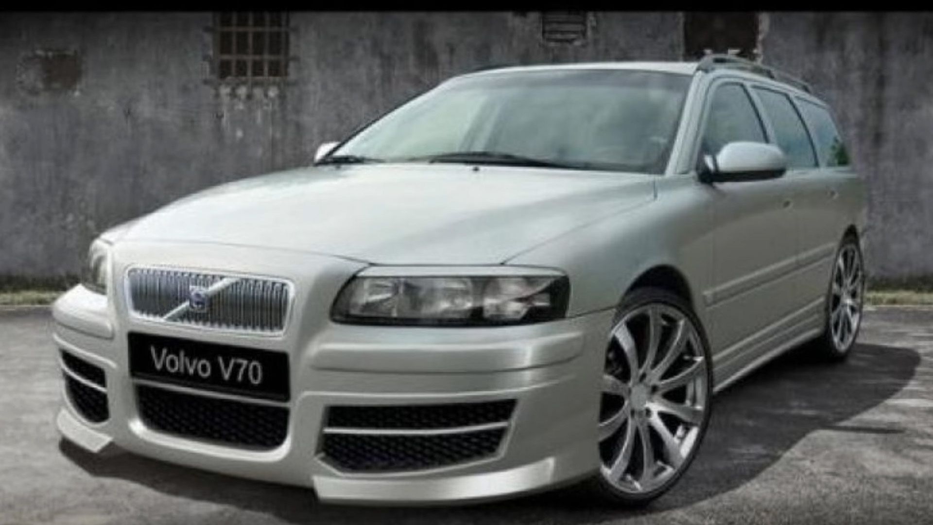 silver Volvo V70 with a wide body kit 