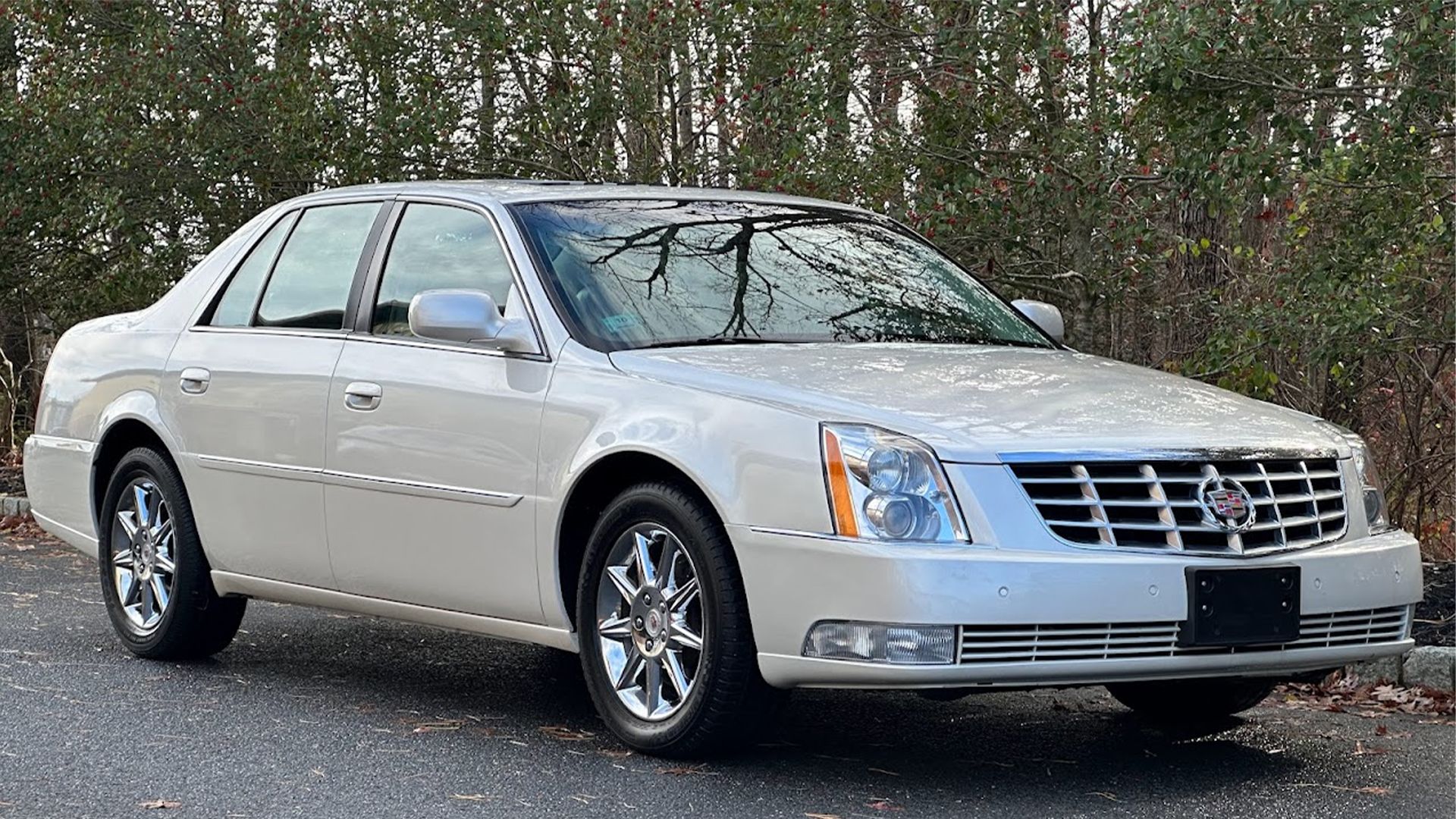 white 2010 Cadillac DTS parked