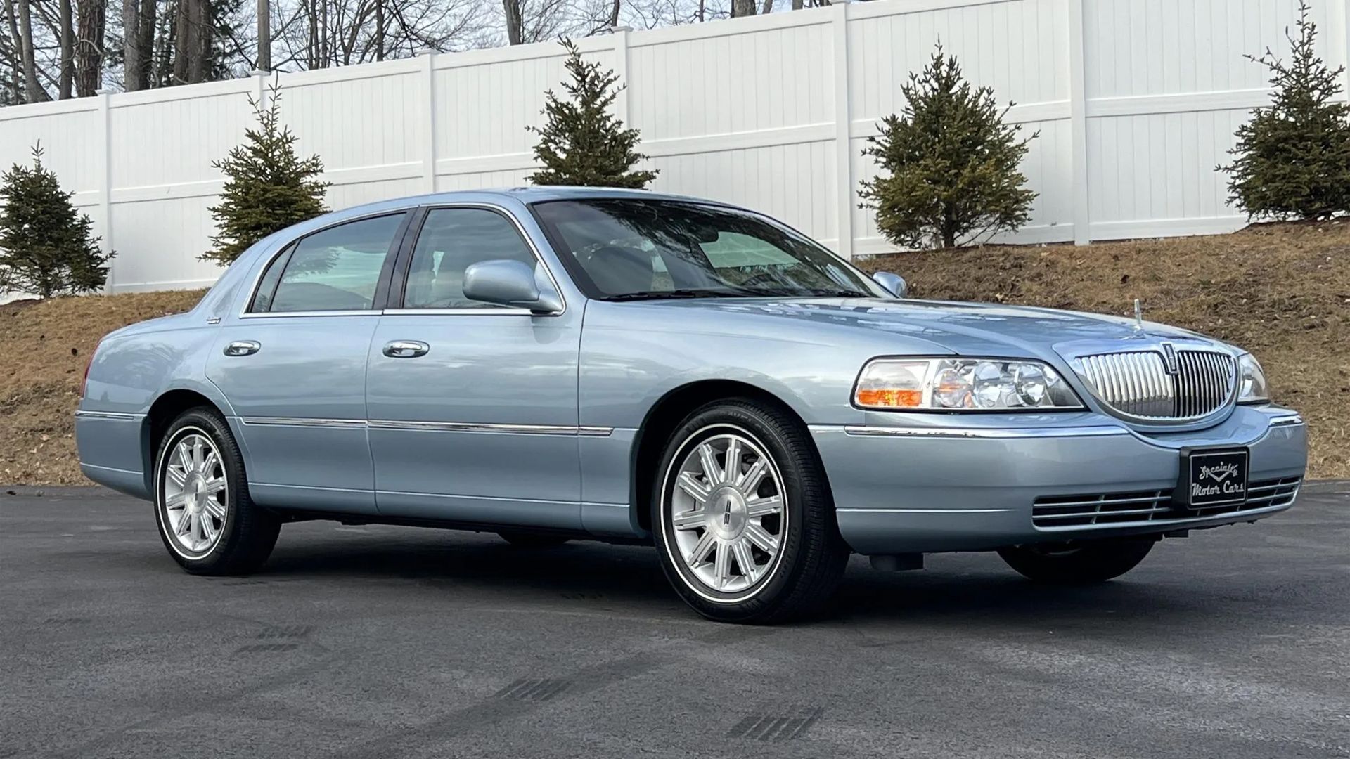 light blue 2011 Lincoln Town Car Signature Limited parked