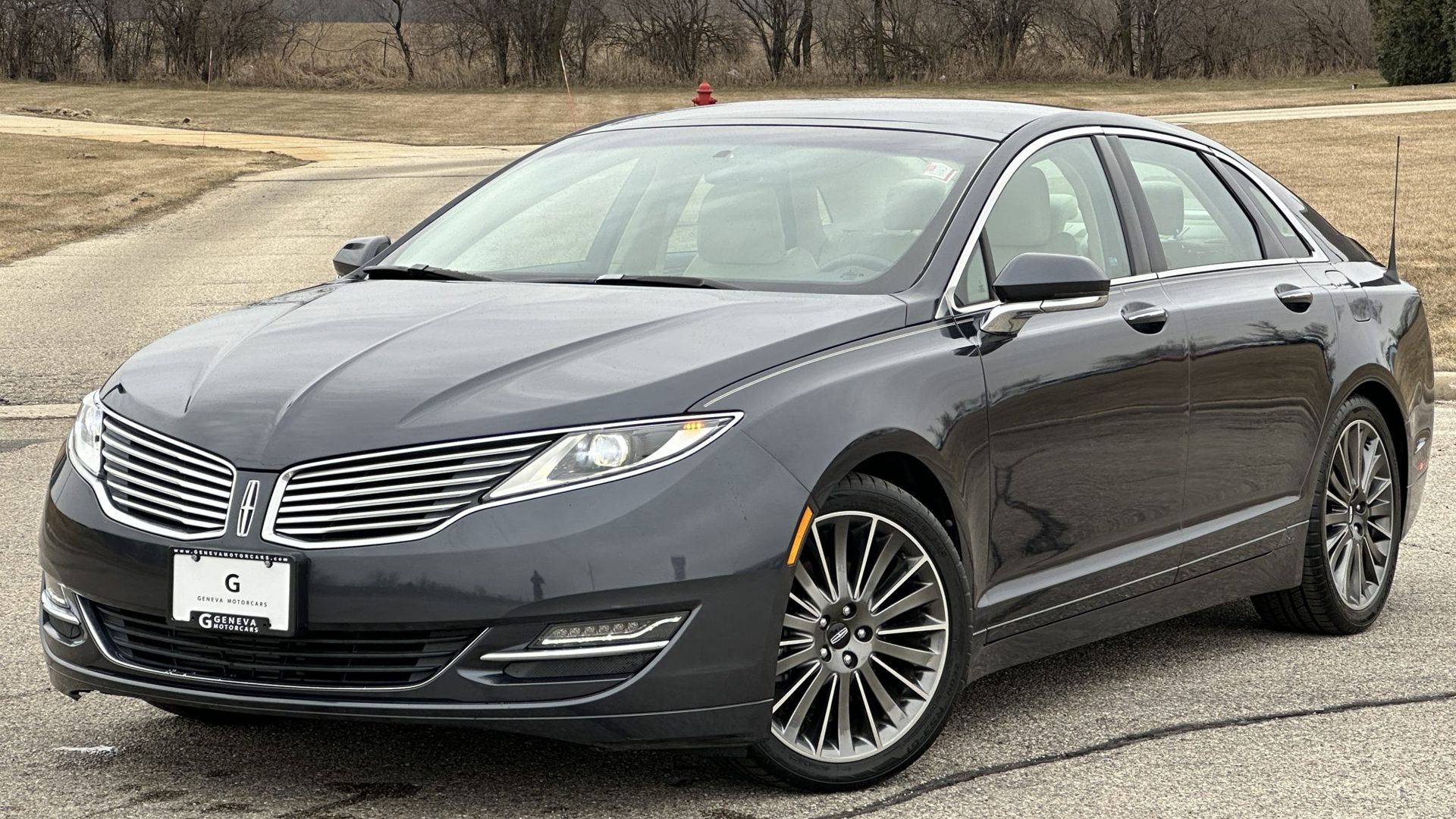 black 2013 Lincoln MKZ parked