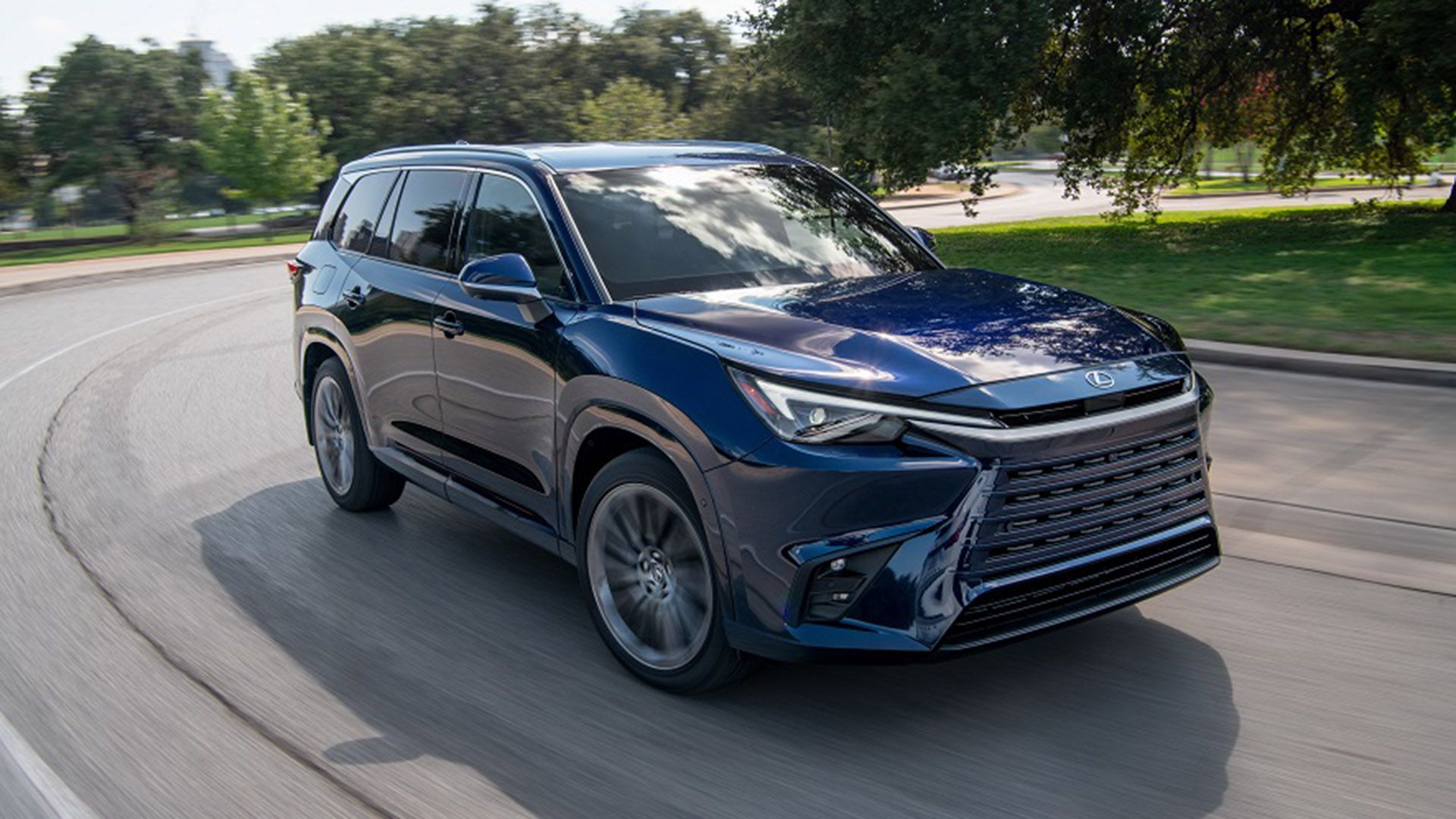 Black 2024 Lexus TX 550h Luxury driving