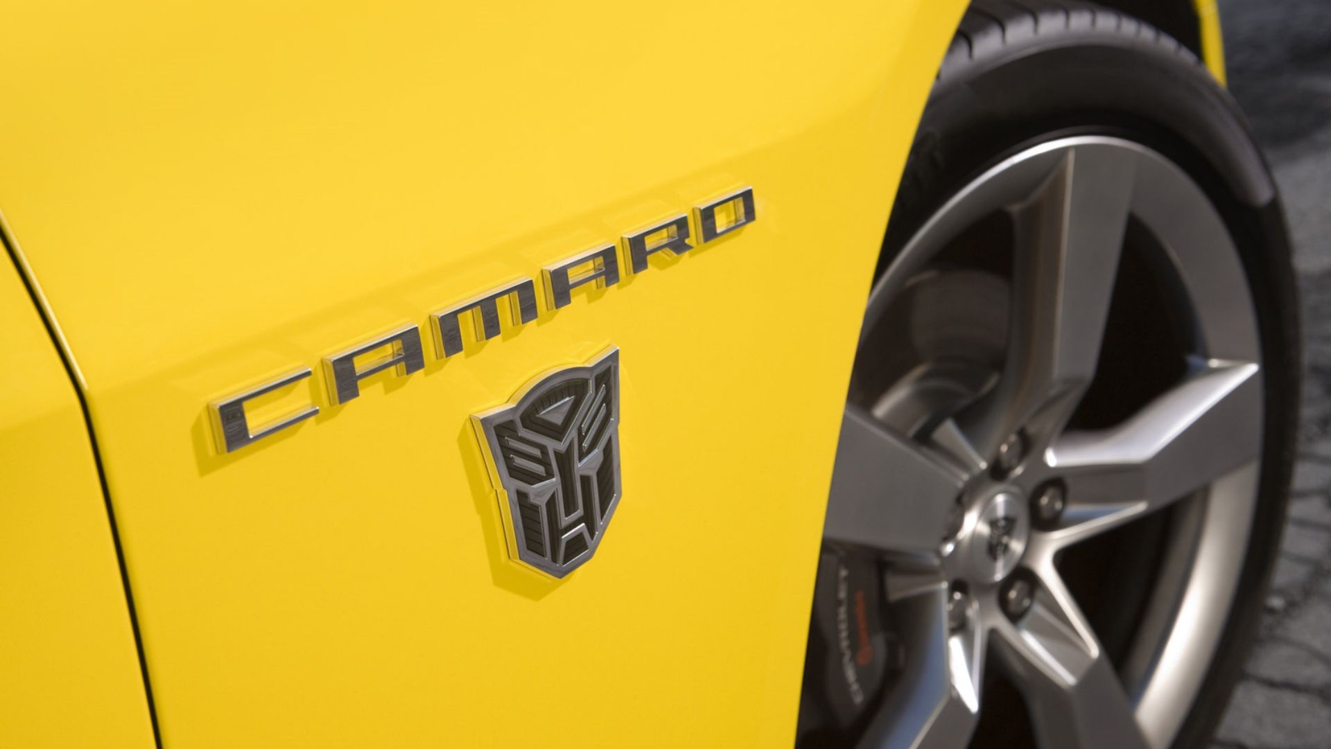 chevrolet camaro transformers edition fender badge close up yellow