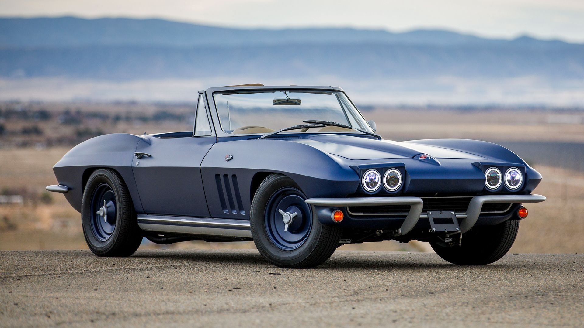 1965 Chevrolet Corvette Convertible with flip-up lights illuminated