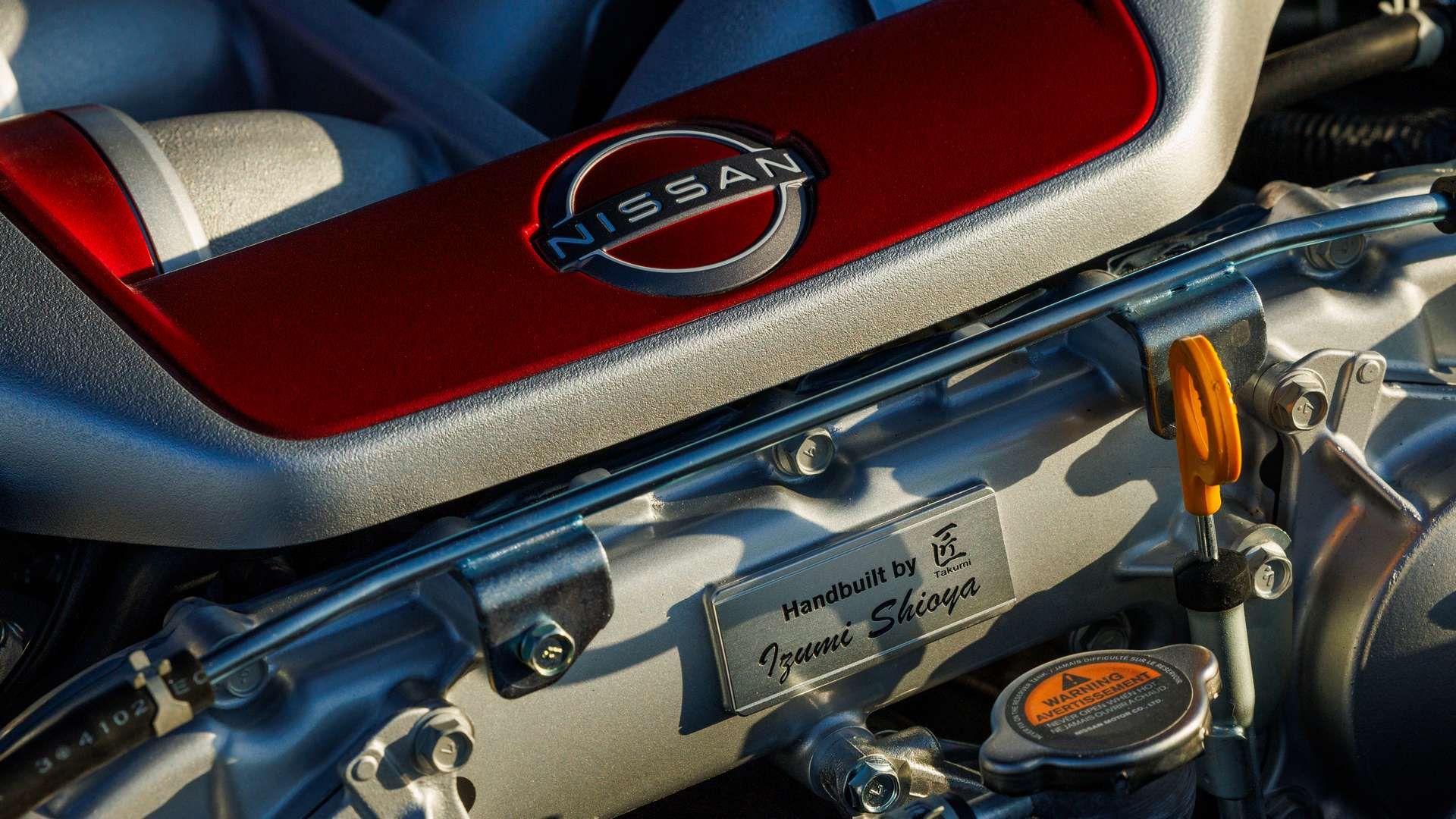 Emblema vermelho do motor no T-Spec Takumi Edition